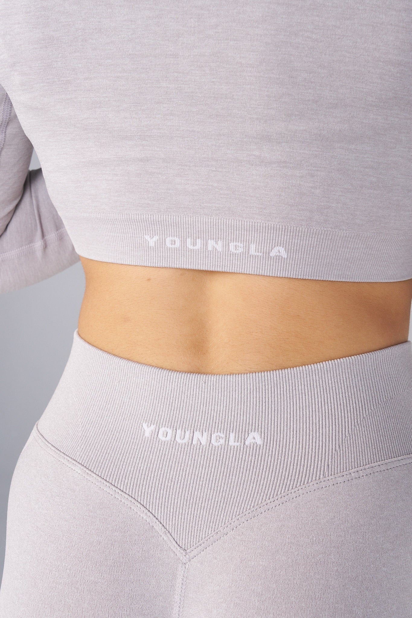 Side view of the mens quarter zip highlighting the hourglass fit