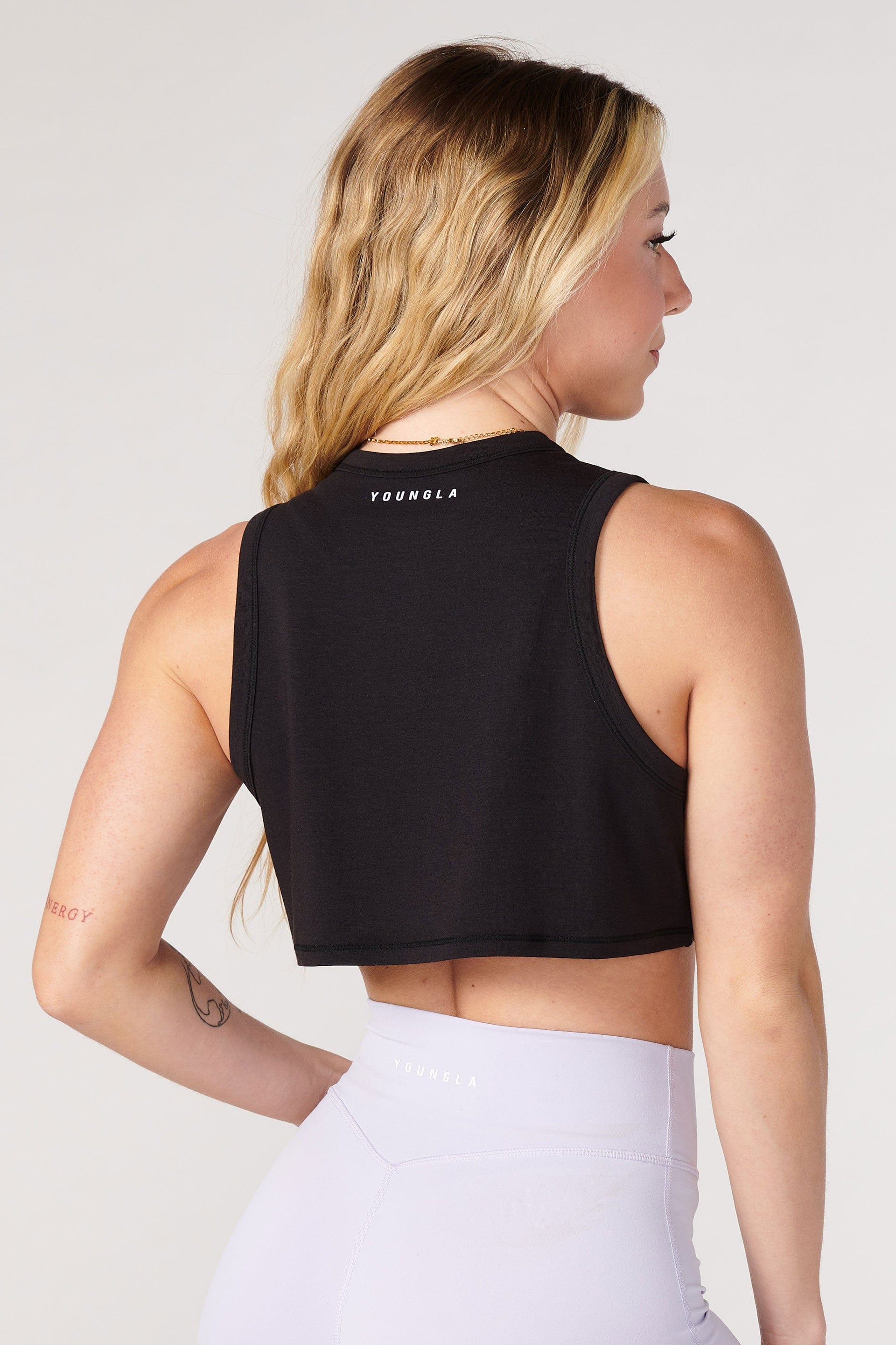 Front view of the Cloud Comfort Modal Workout Tank in a gym setting.