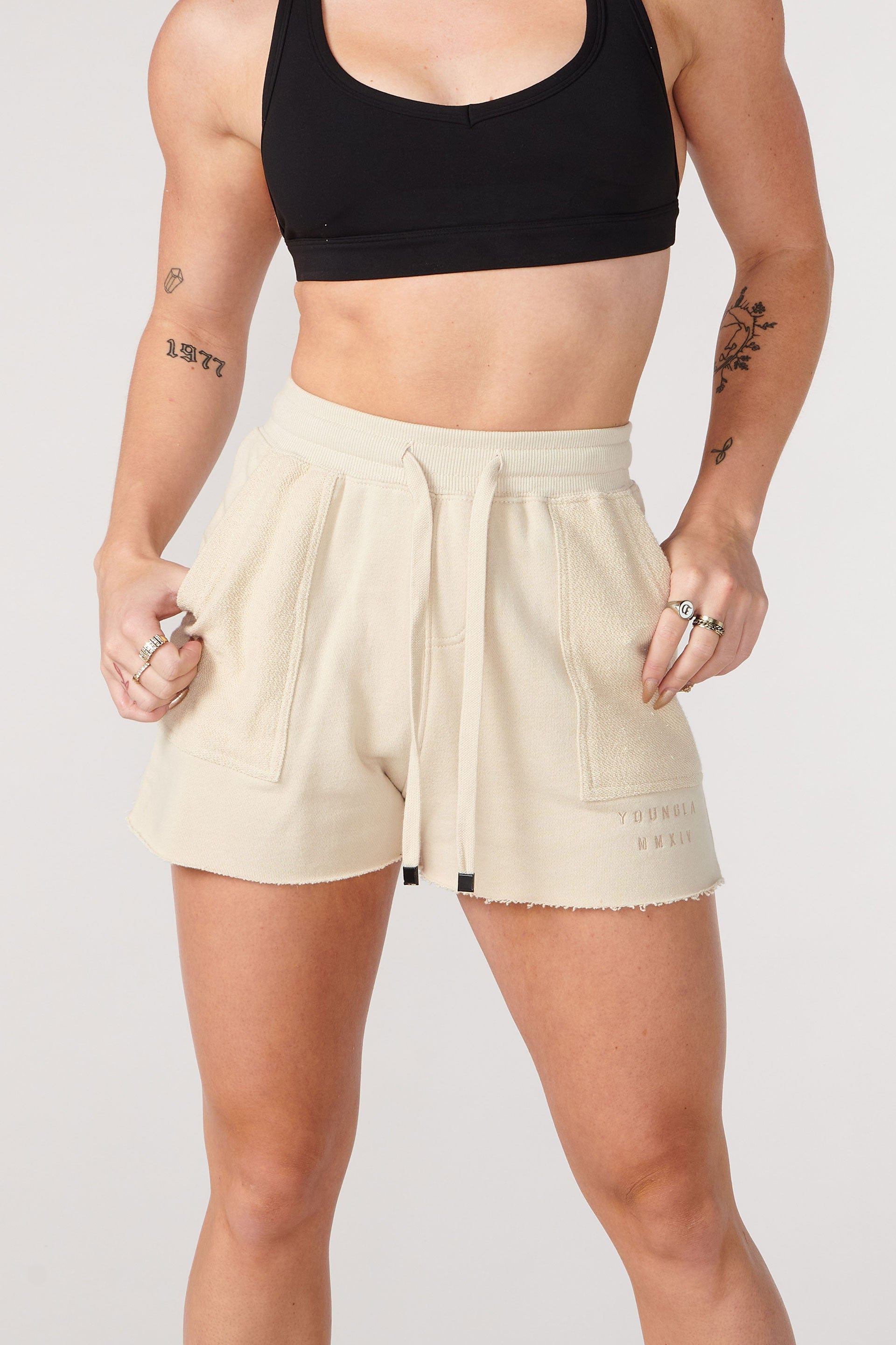 Model wearing YoungLA summer shorts in a relaxed outdoor environment.
