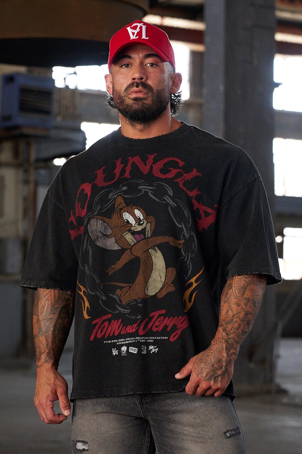 Front view of oversized Tom & Jerry graphic T shirt with bold cartoon print