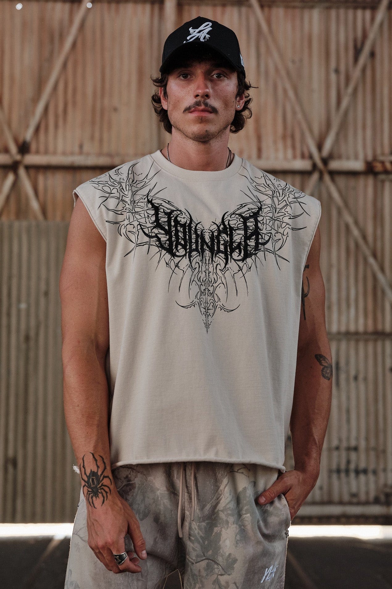 Front view of Dark Wave sleeveless graphic t-shirt with tribal print.