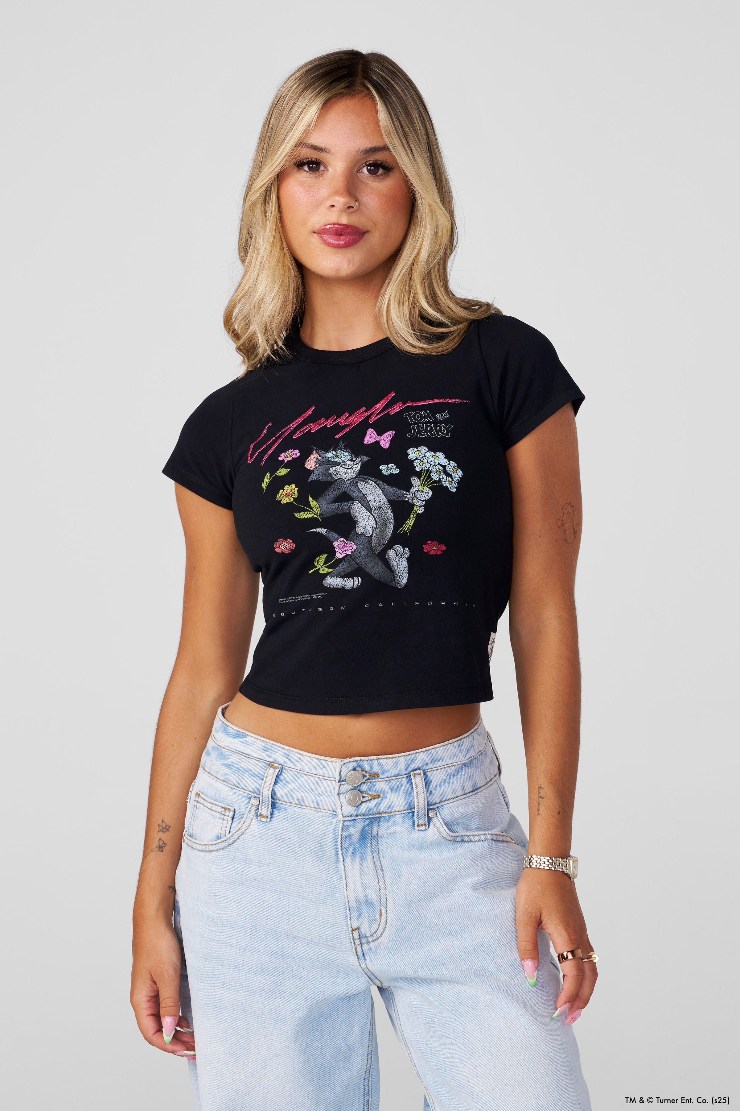 Baby wearing Tom and Jerry t shirt during playtime, showcasing comfort