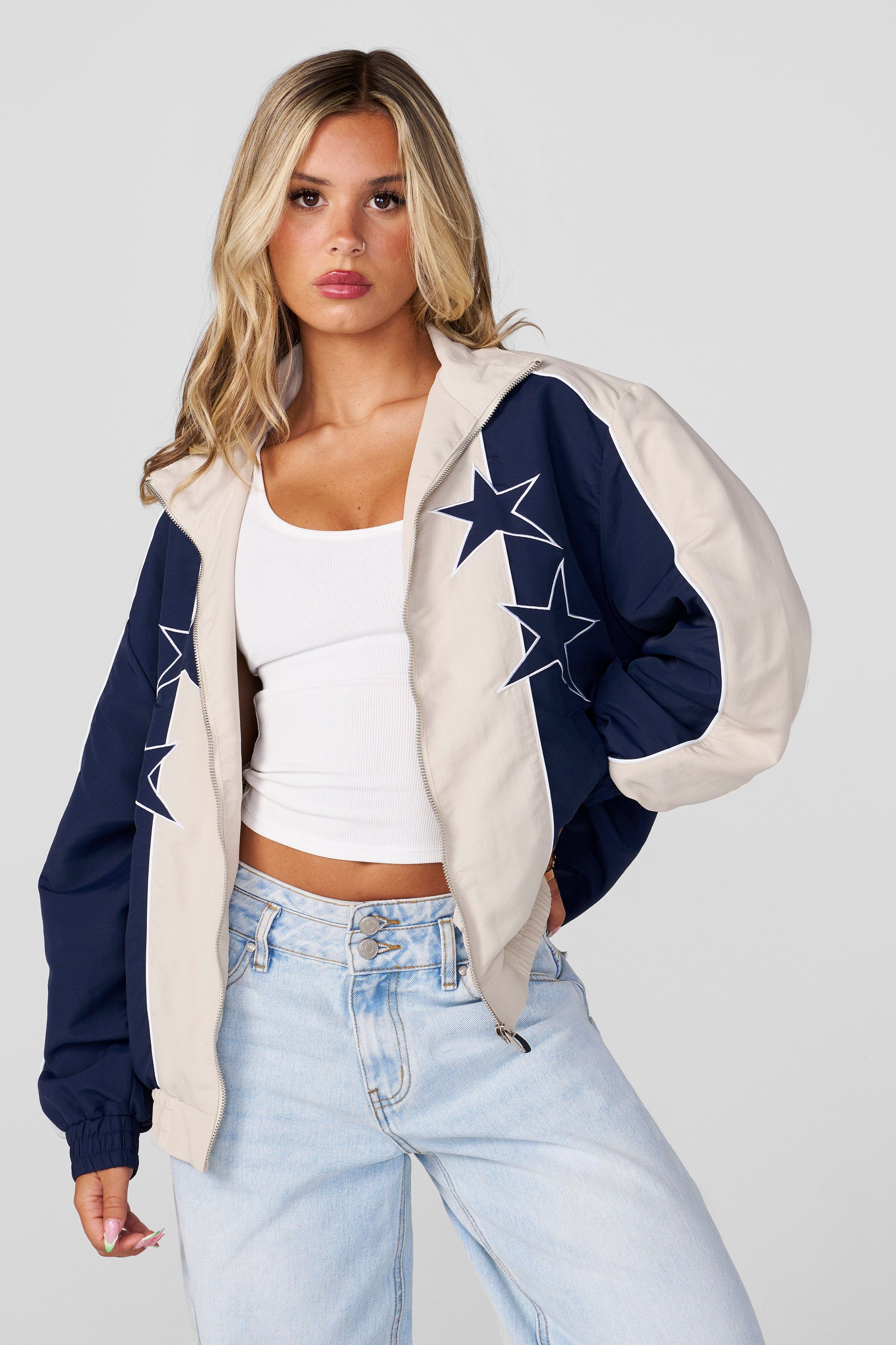 Model wearing oversized denim jacket, ideal for casual outings.