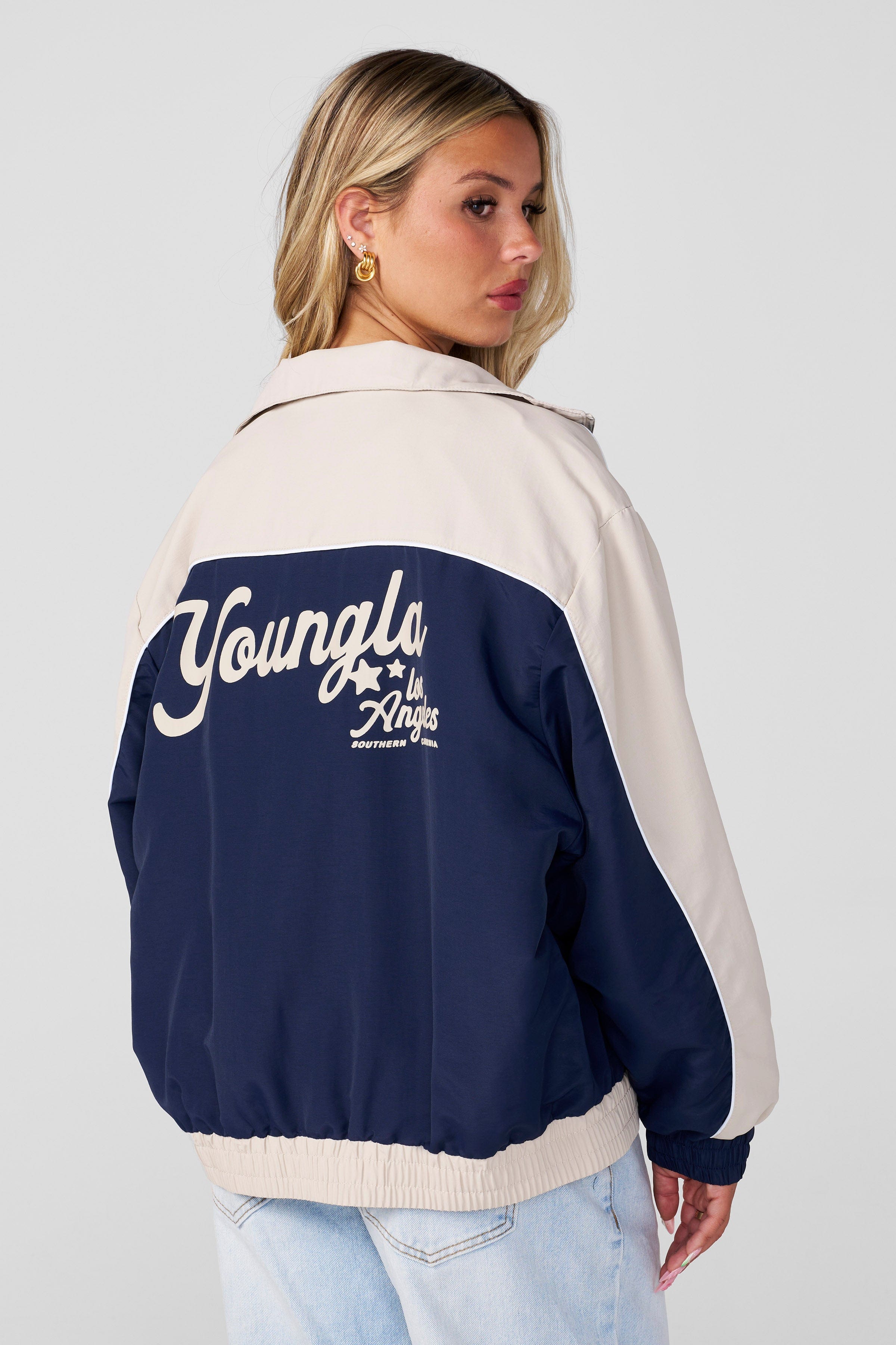 Front view of retro oversized windbreaker jacket, showcasing its relaxed fit.