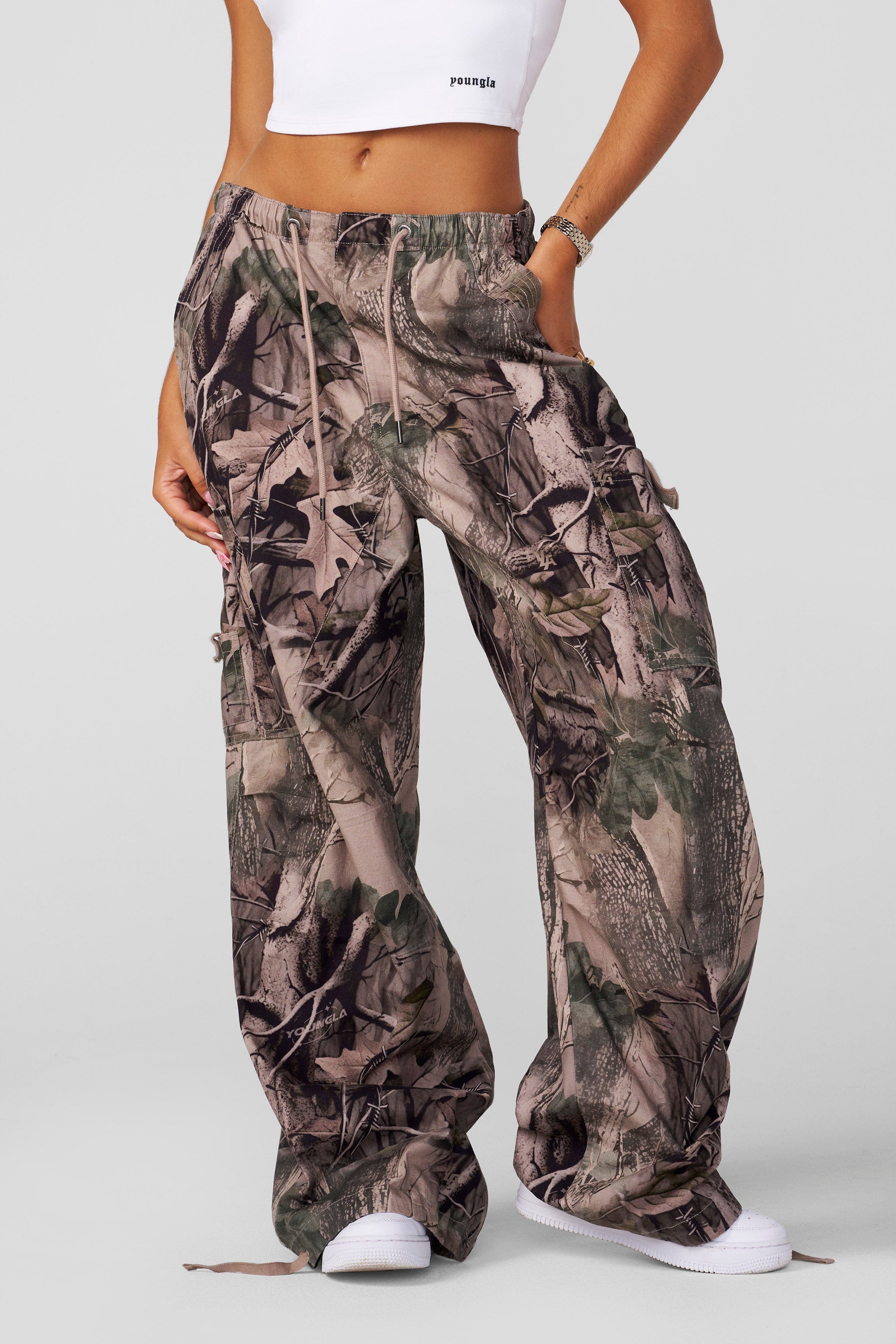 Front view of baggy cargo pants with drawstring waist and cuffed ankles