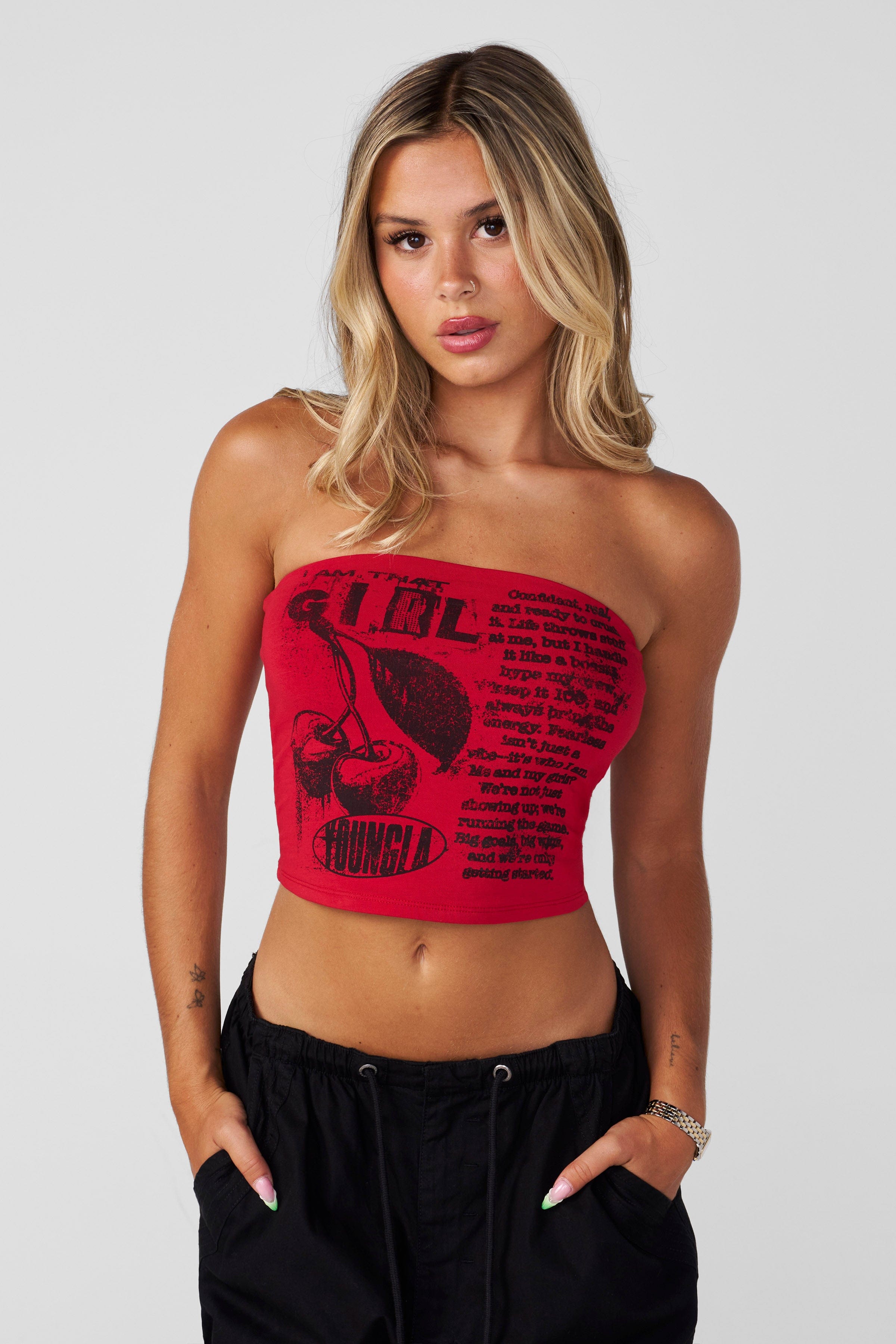 White tube top paired with denim shorts for a casual look.