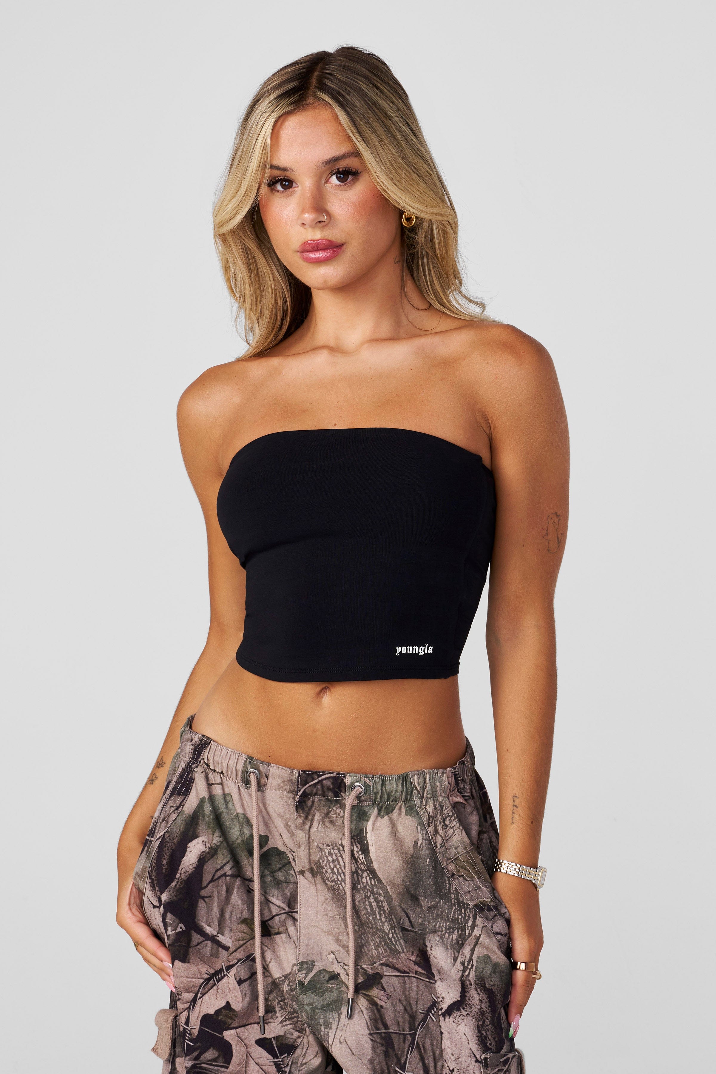 Black tube top on a model at a summer festival.