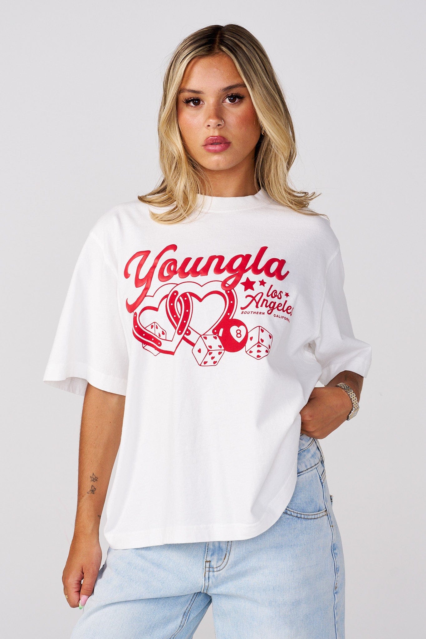 Close-up of oversized graphic tee showing bold artwork and textured cotton
