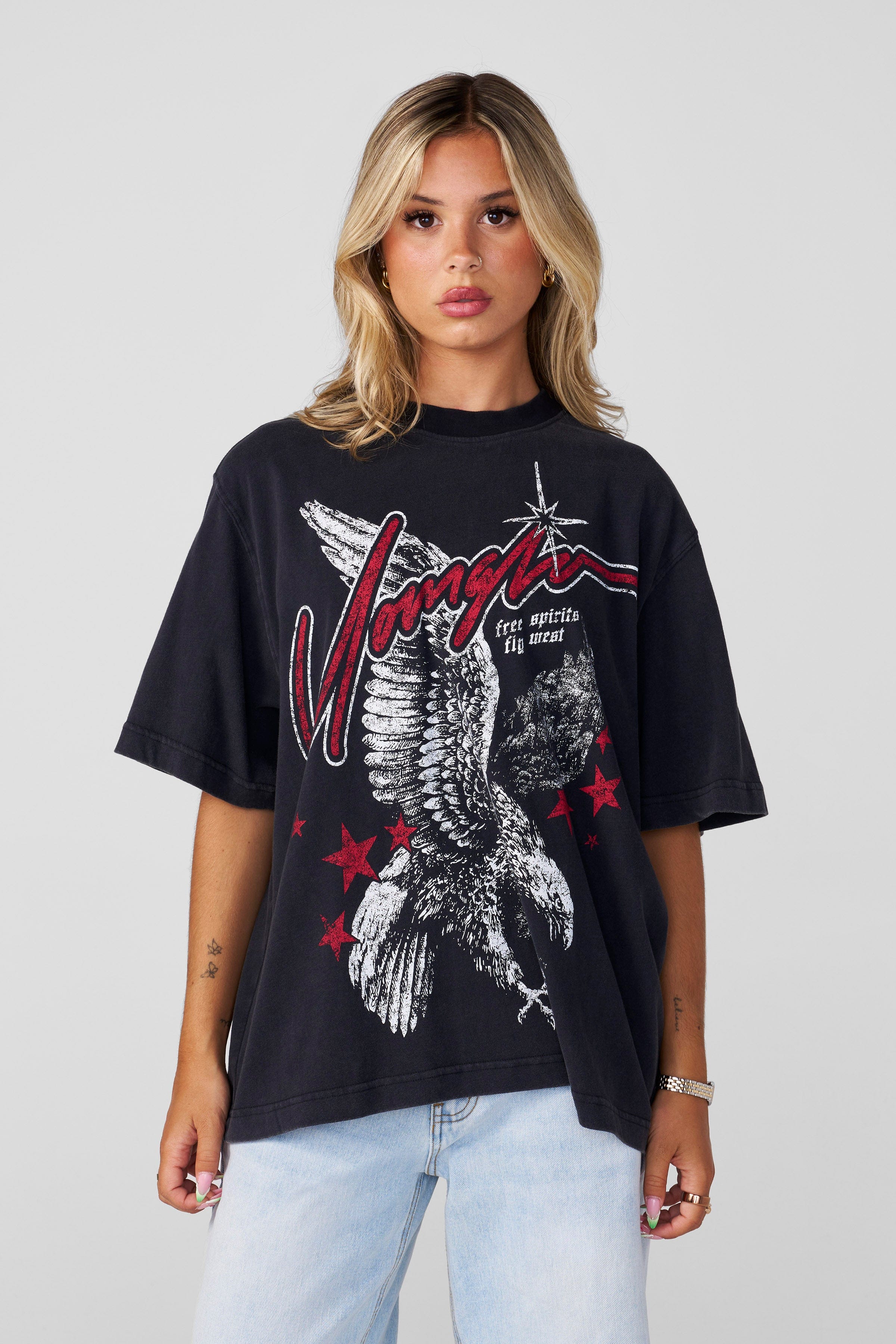 Close-up of oversized graphic tee showing bold artwork and textured cotton