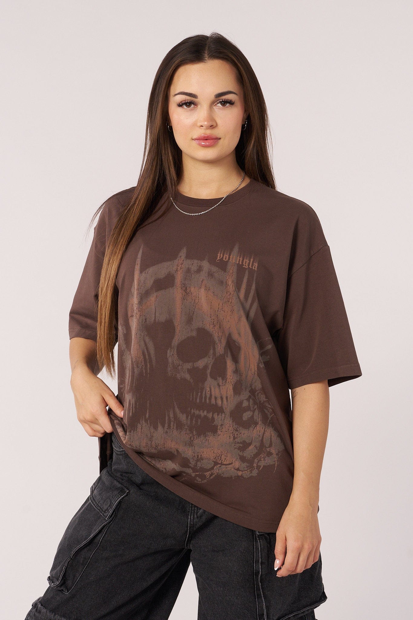 Front view of the skull graphic oversized tee on a model