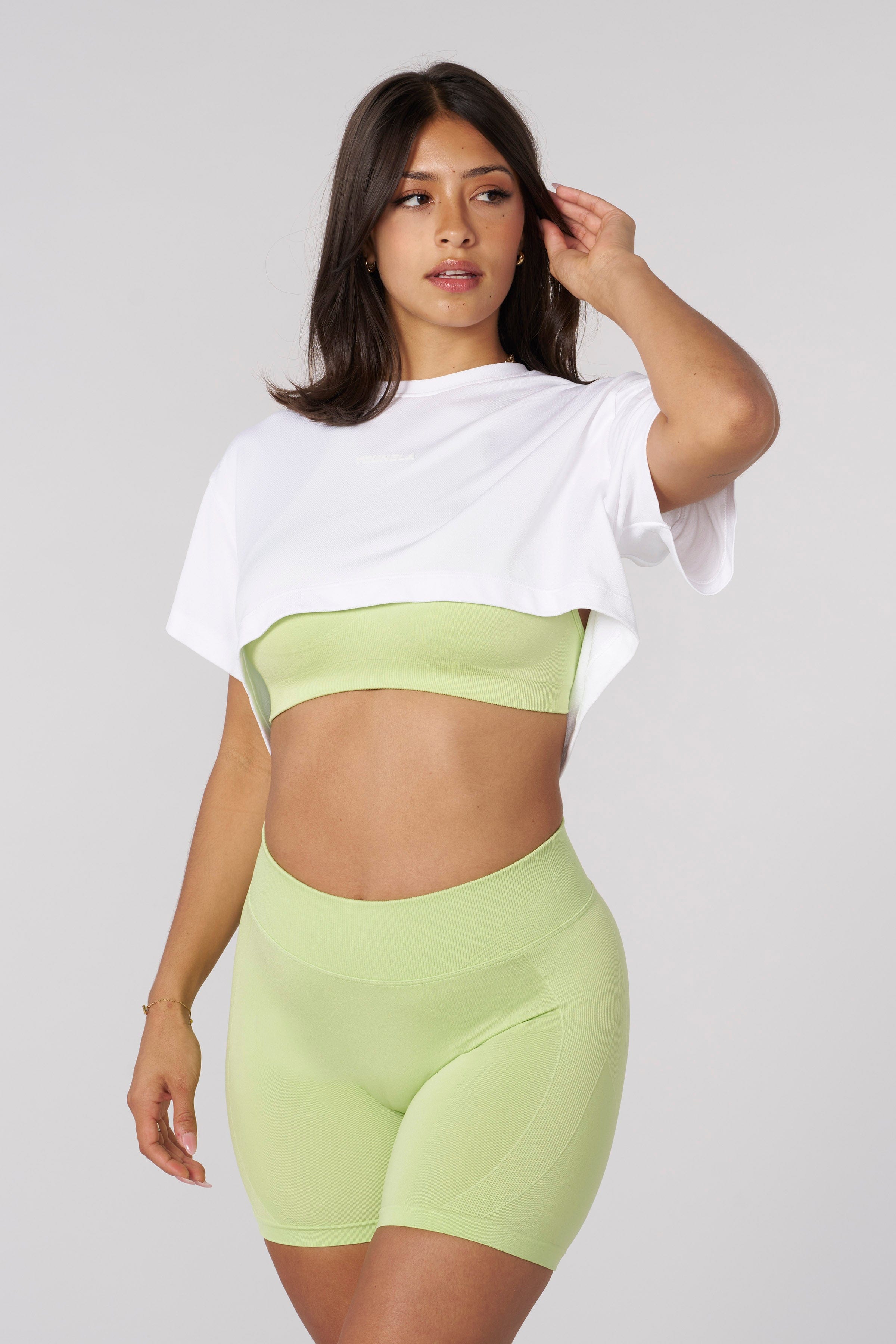 Front view of the high-low hem crop tee during workout