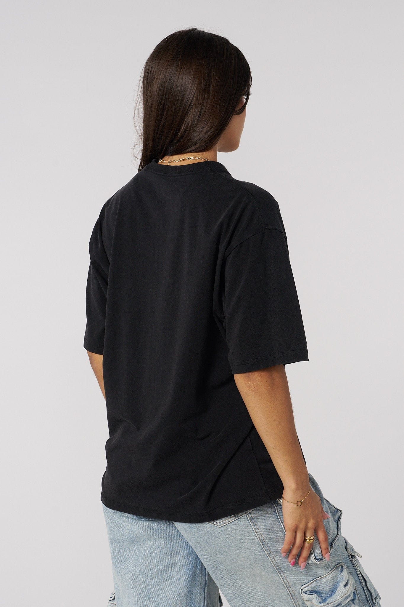 Back view showing the relaxed fit of the oversized tee