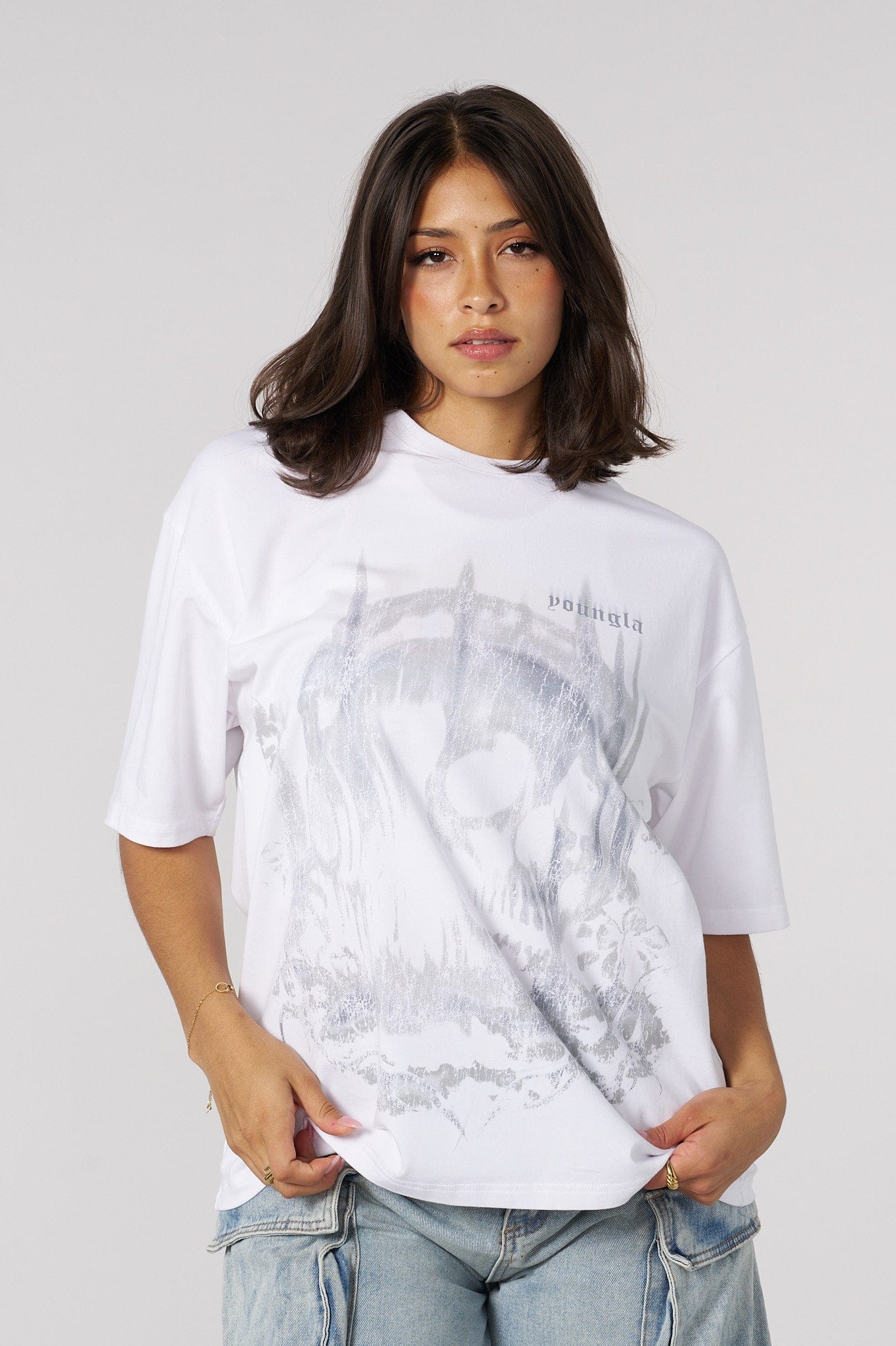 Front view of the skull graphic oversized tee on a model