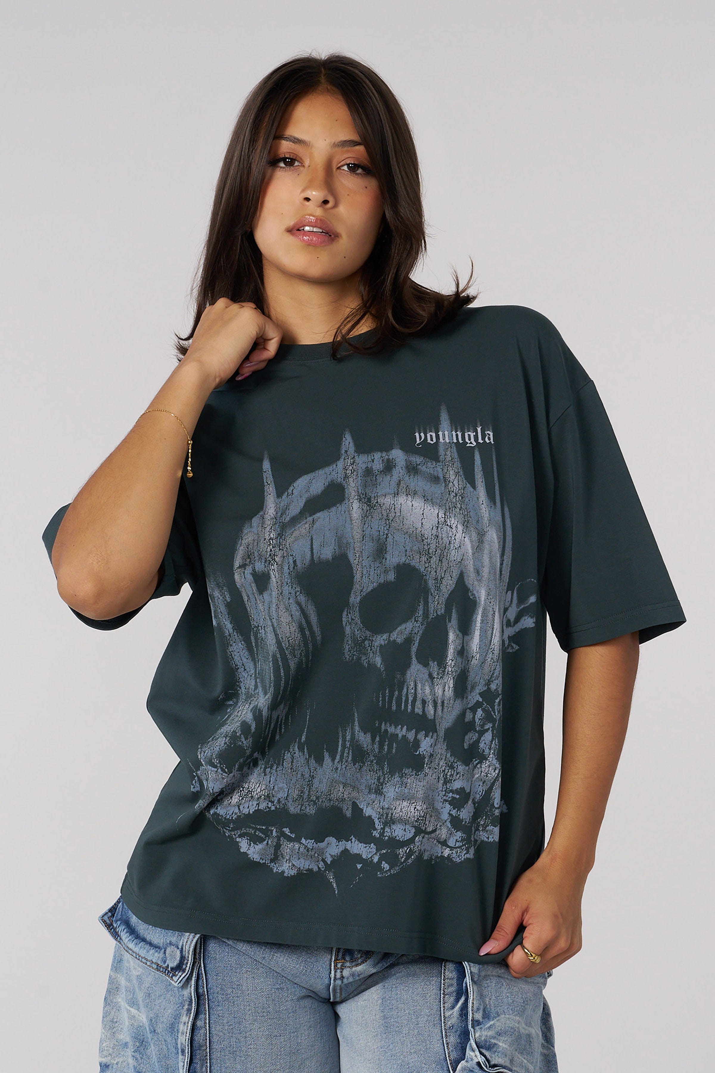 Front view of the skull graphic oversized tee on a model