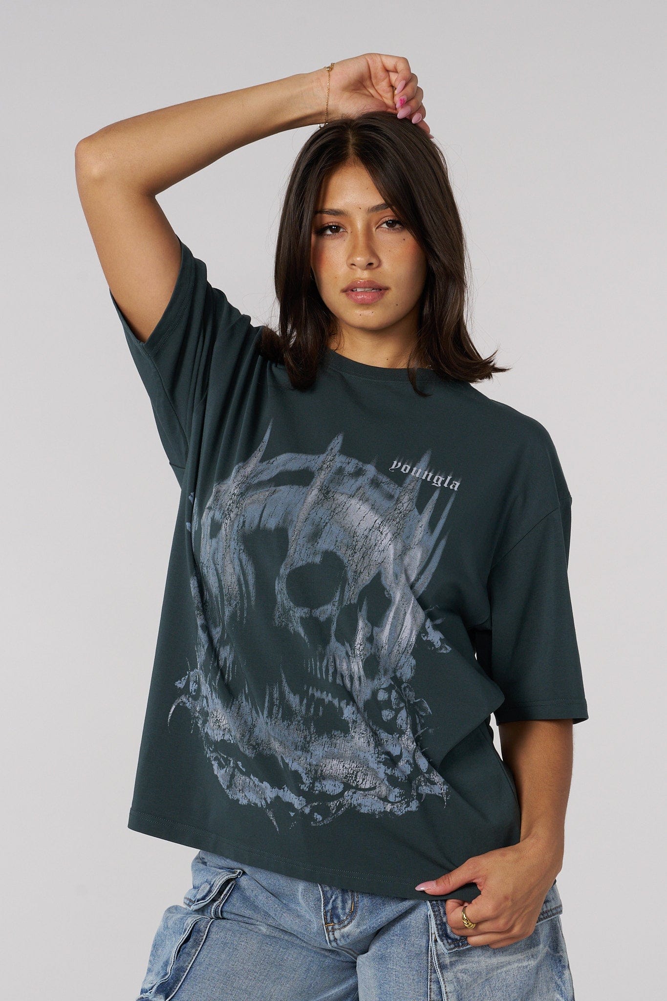 Front view of the skull graphic oversized tee on a model