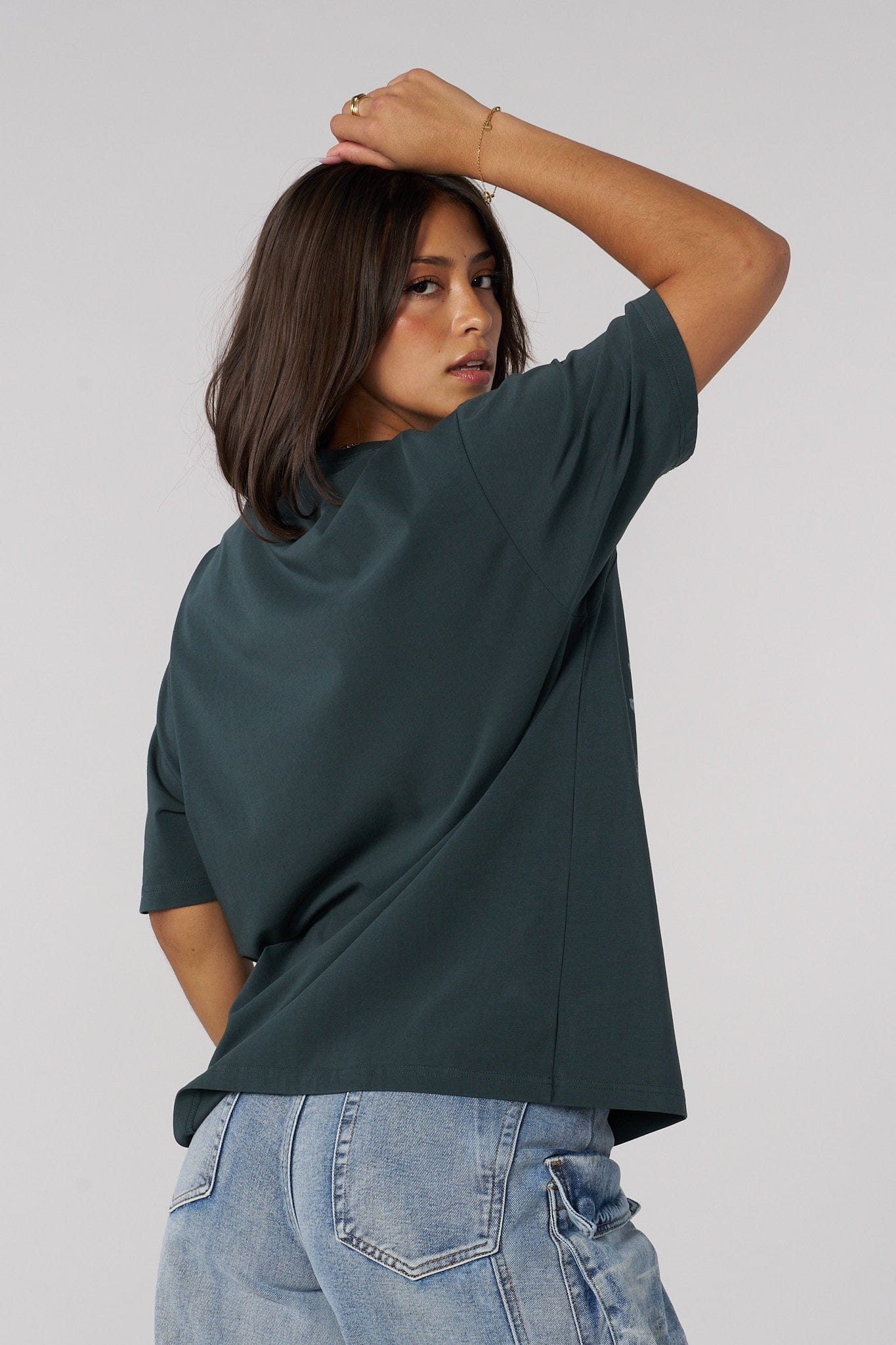 Back view showing the relaxed fit of the oversized tee