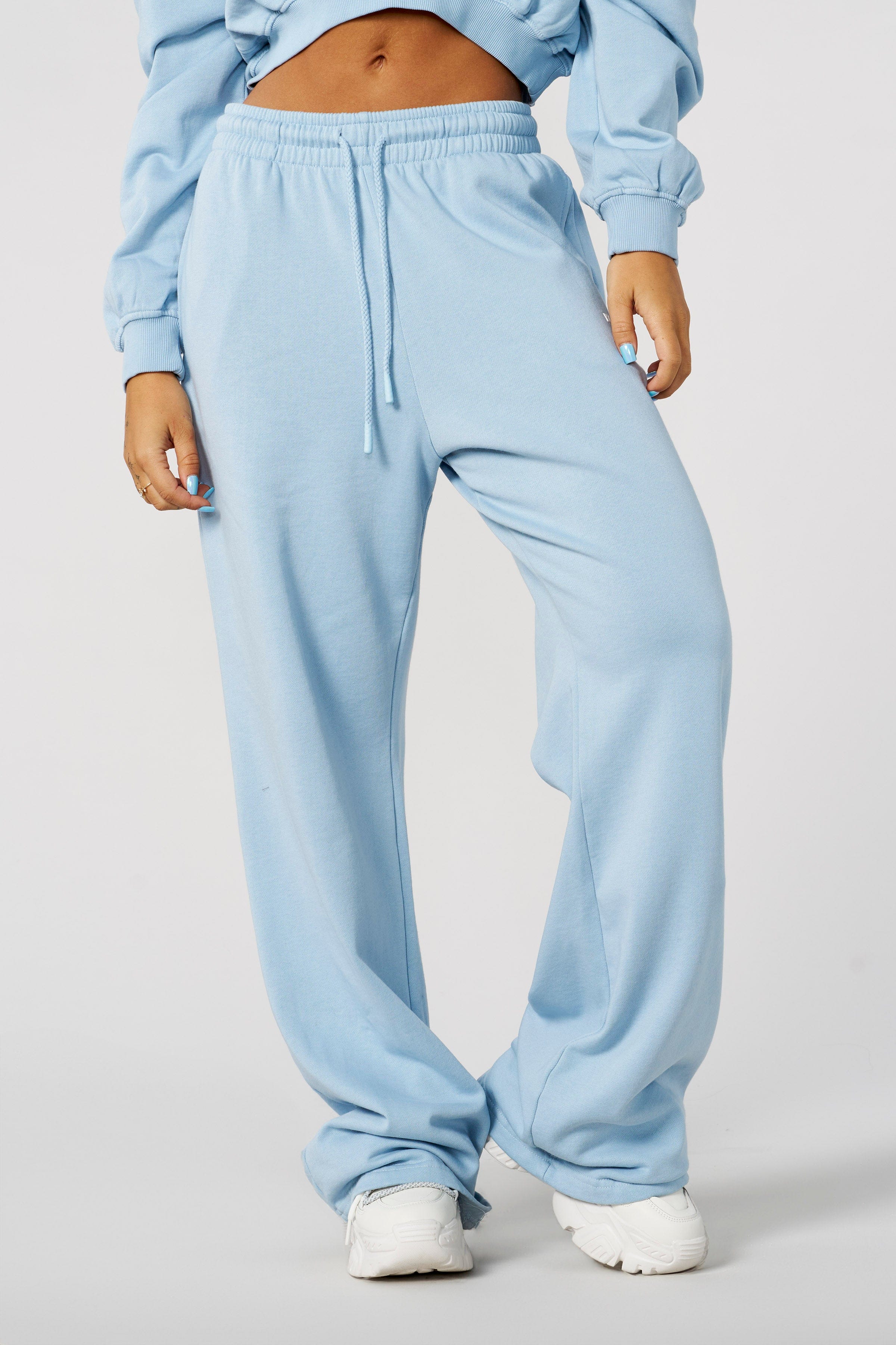Model wearing slim joggers, emphasizing comfort and style.
