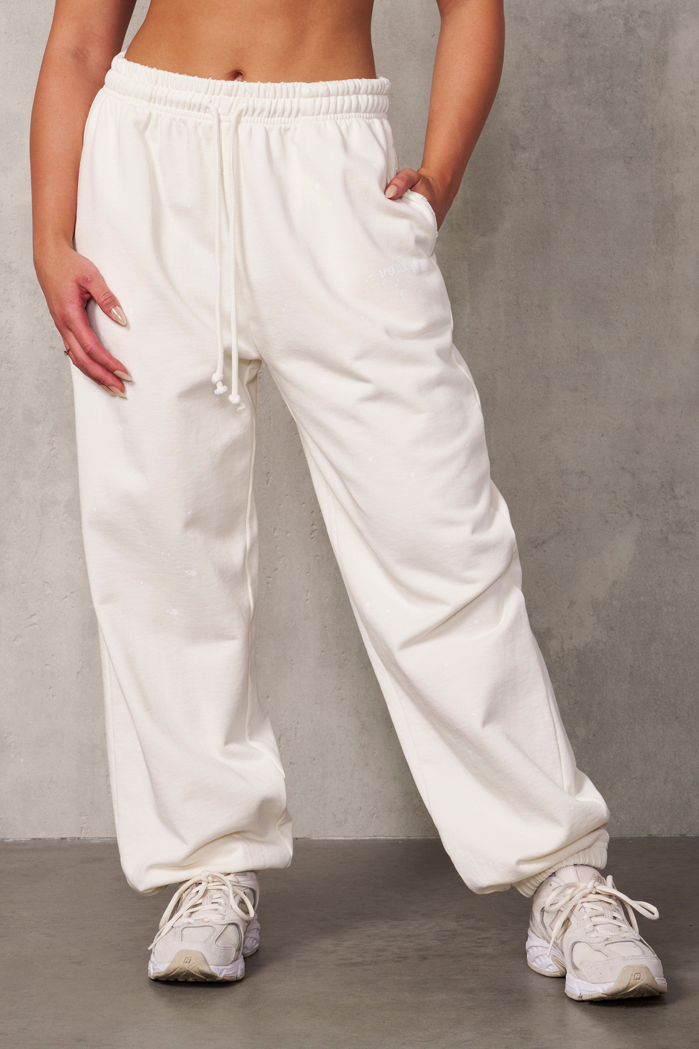 Front view of Ravage distressed joggers on a model, showcasing oversized fit and streetwear style.