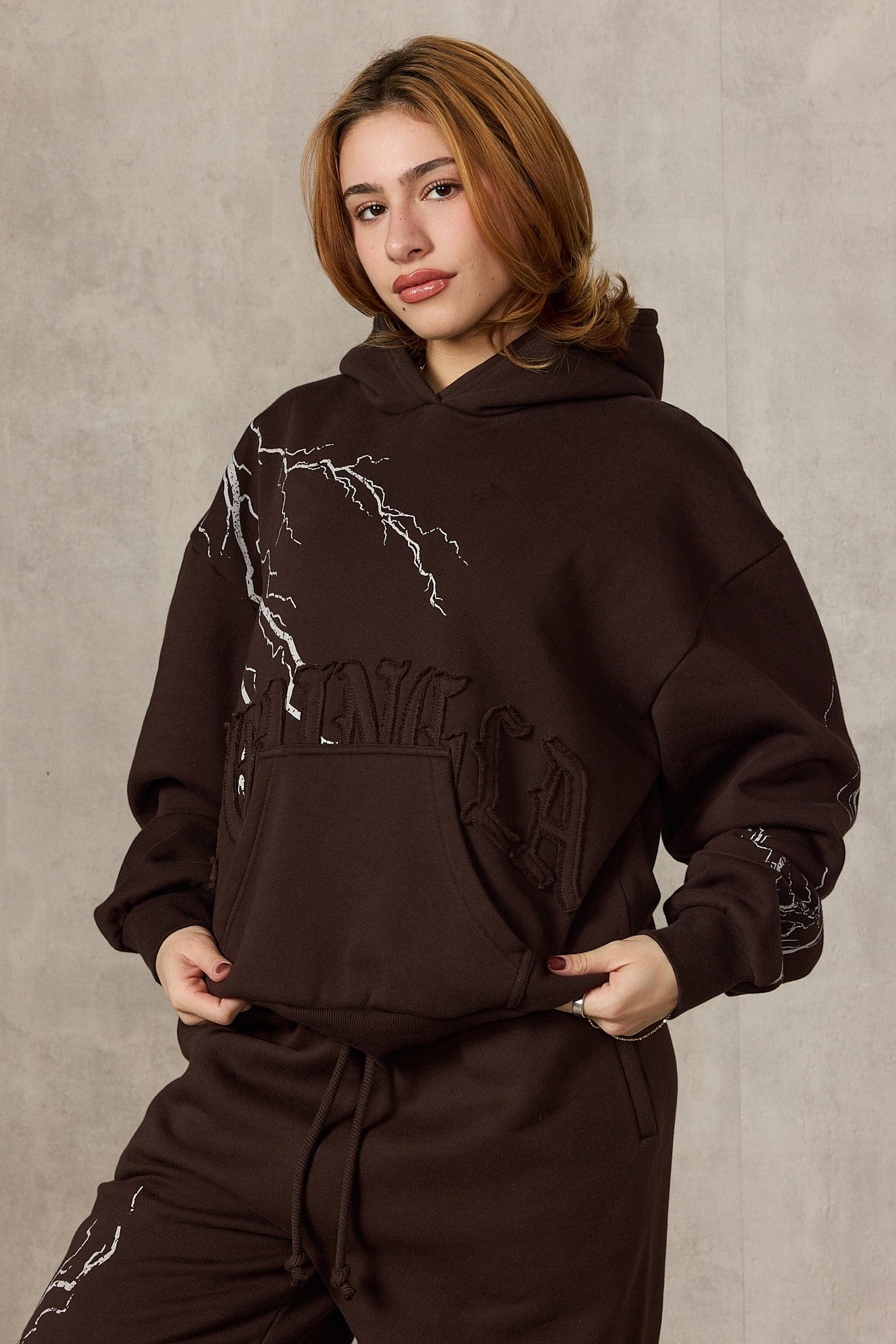 Close-up of the YoungLA oversized hoodie's lightning print and zip-up design