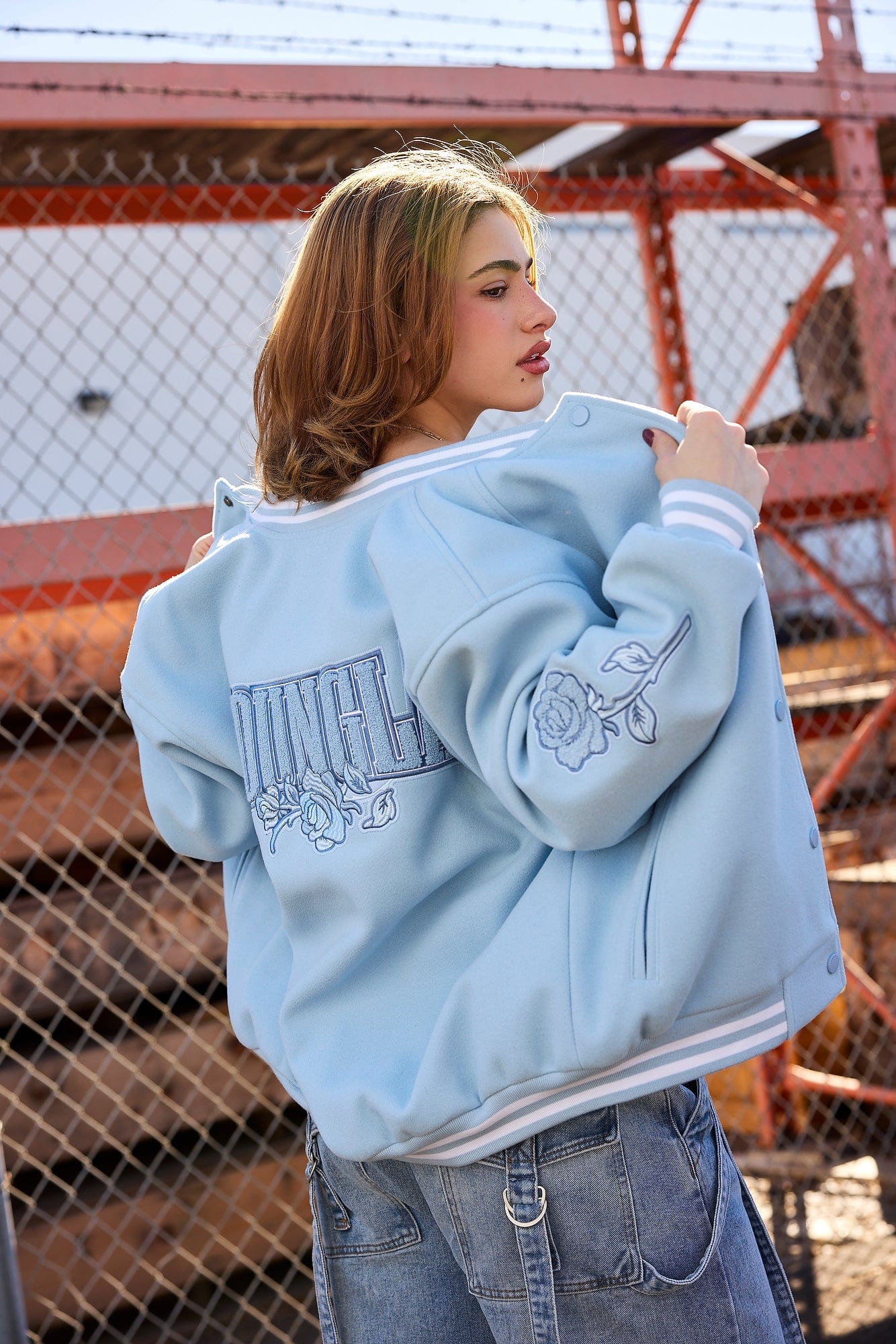 Front view of oversized Ivy League jacket styled with denim jeans