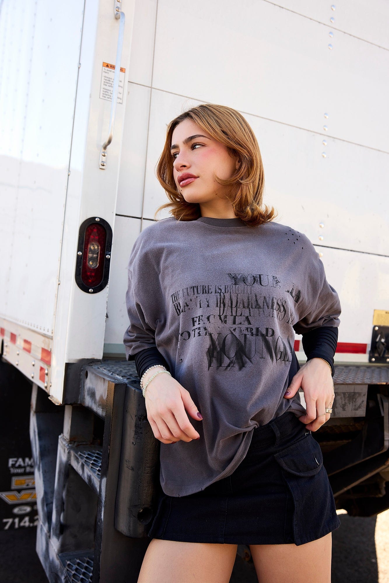 Street-style outfit featuring vintage graphic tee with slim-fit jeans