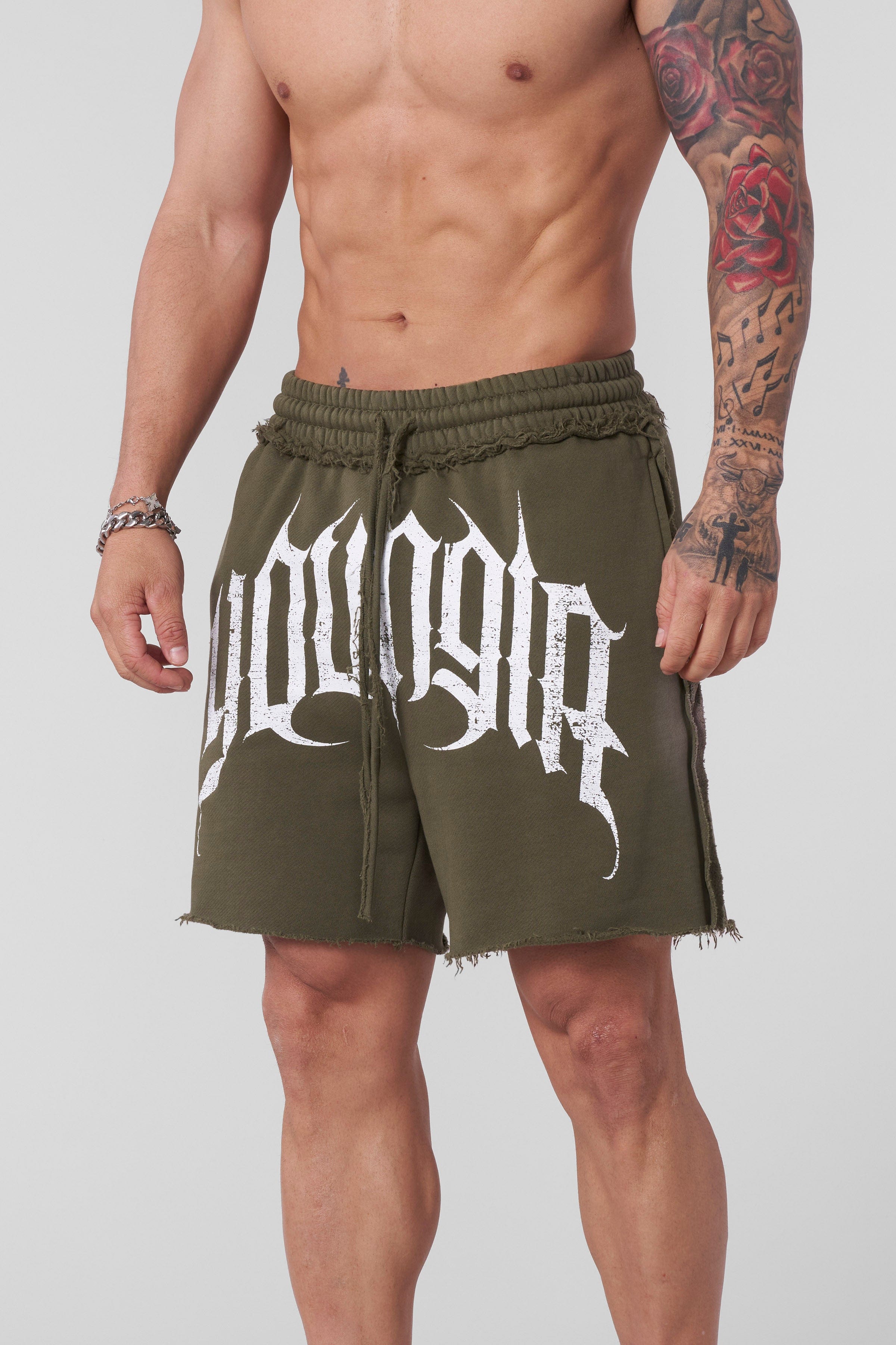 Close-up of raw hems and seams on mens athletic shorts