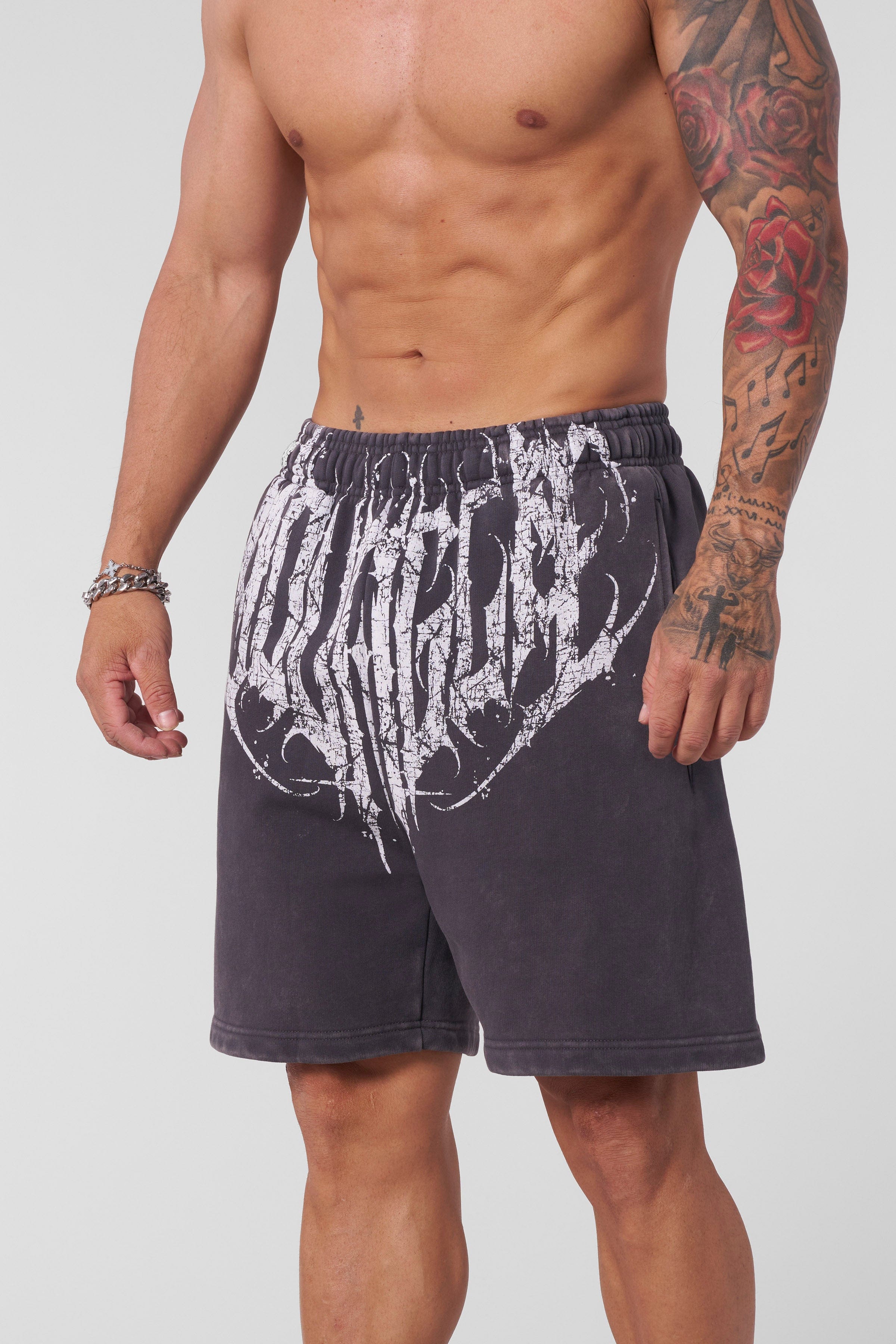 Close-up of Dark Wave baggy shorts showcasing acid-washed finish.