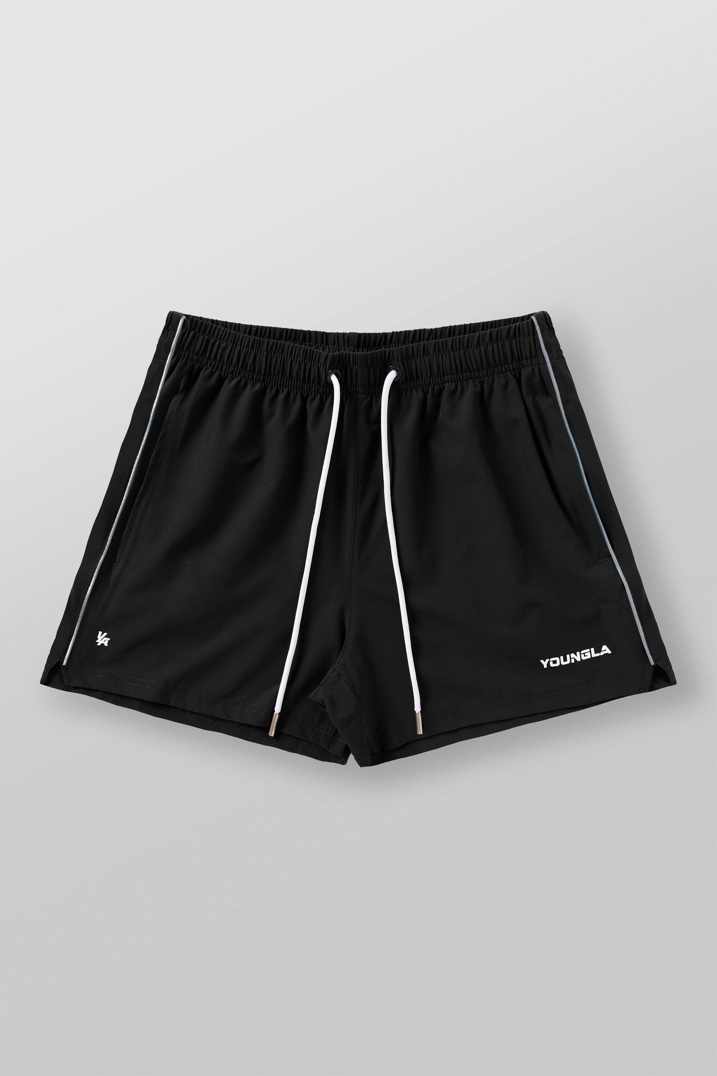 Lifestyle photo of gym shorts styled with workout gear in a city gym