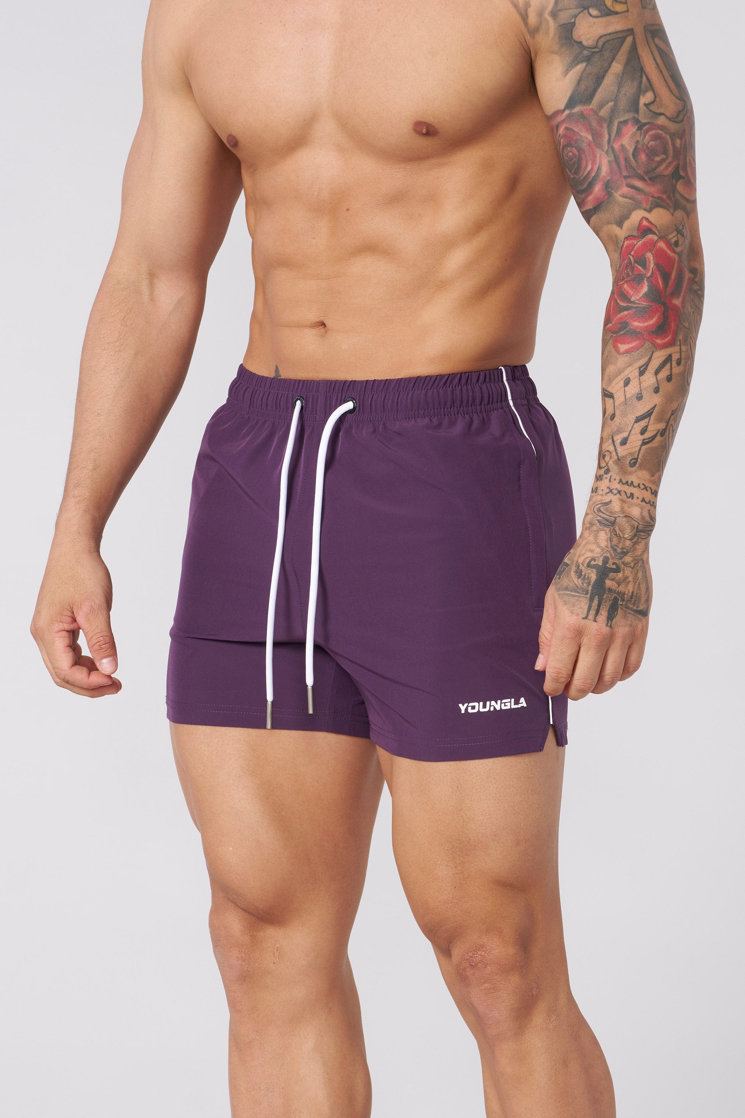 Lifestyle photo of gym shorts styled with workout gear in a city gym