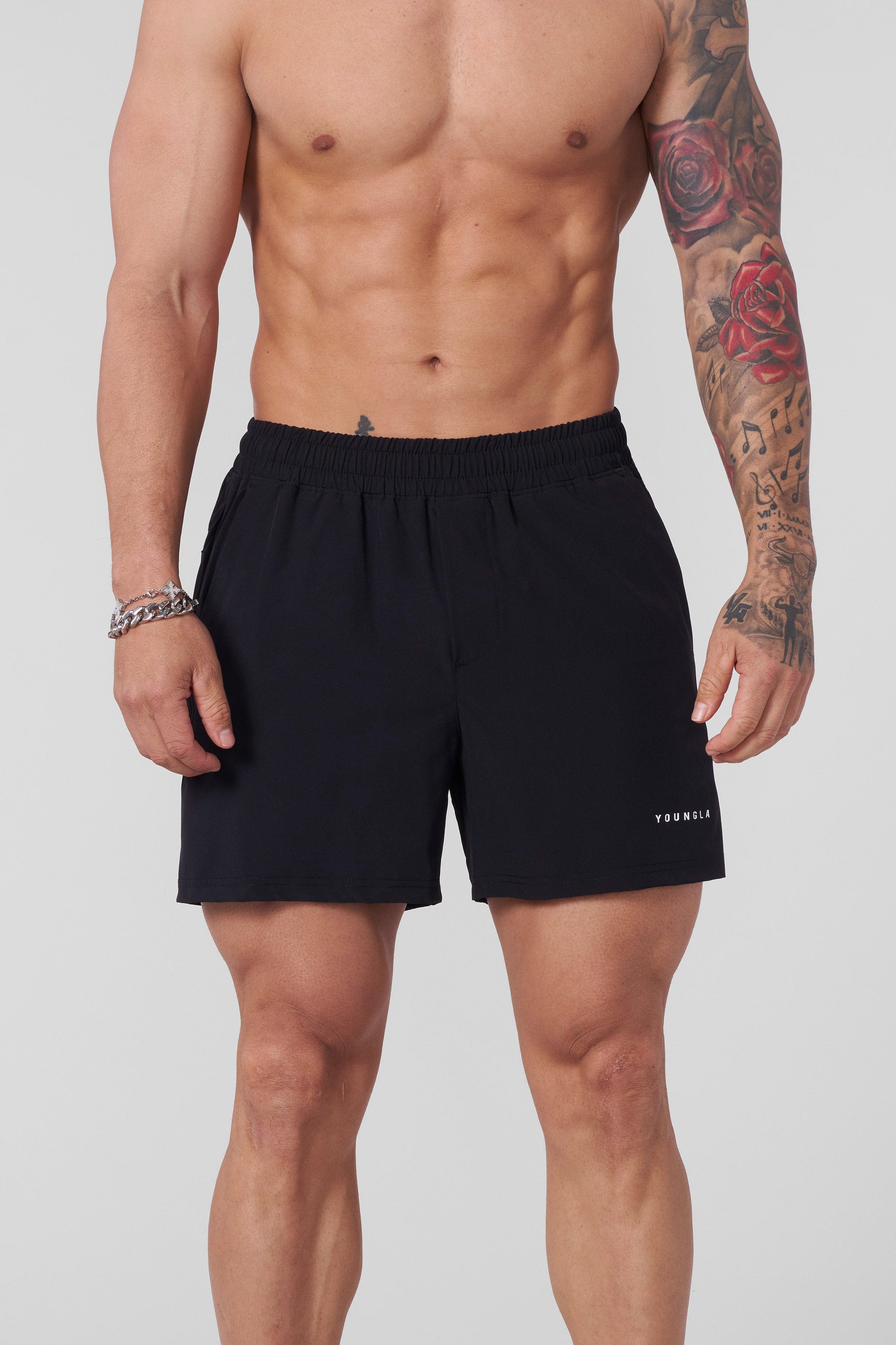 Side angle of model performing lunges wearing lightweight workout shorts