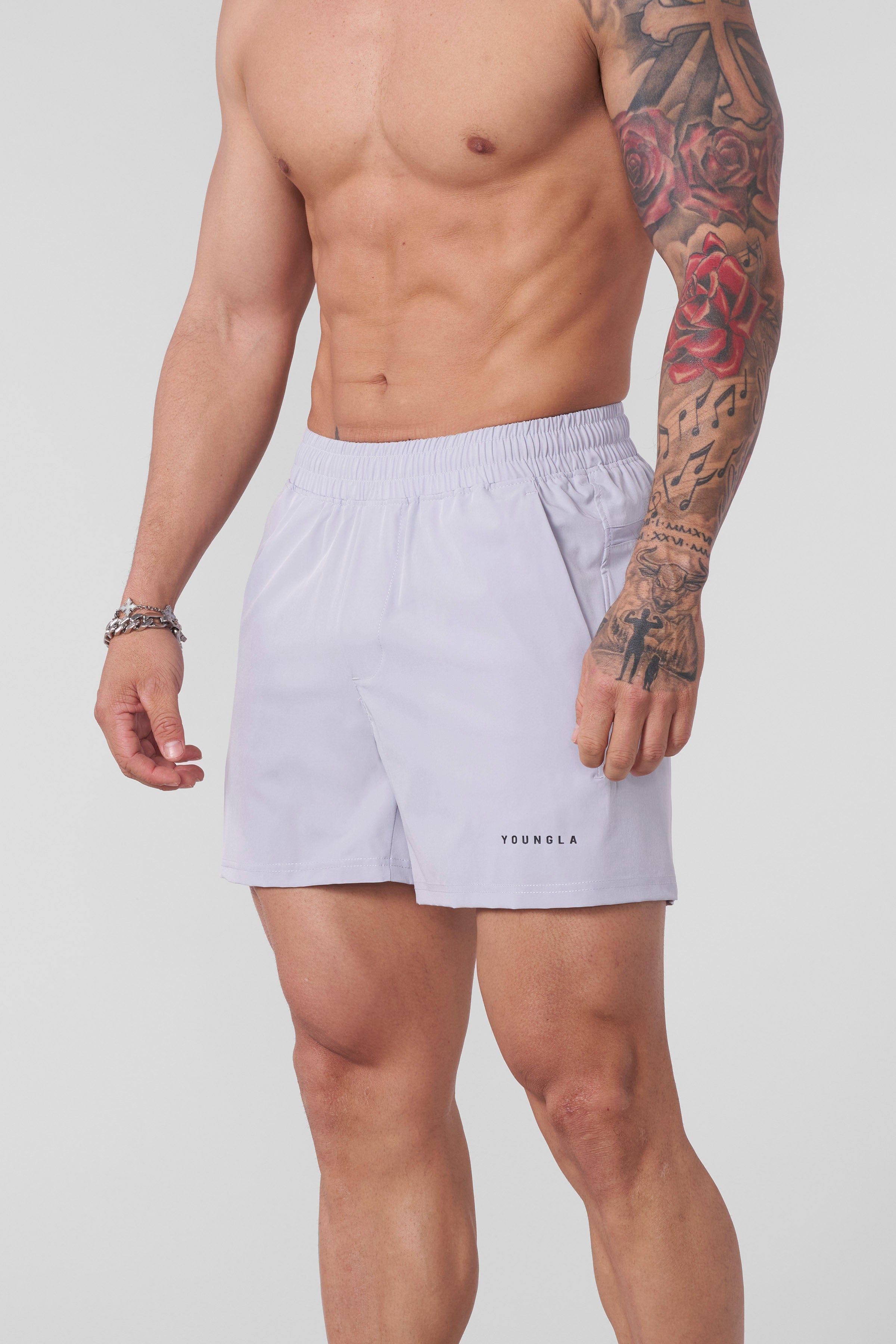 Back view of shorts mens gym style in motion during a morning park run