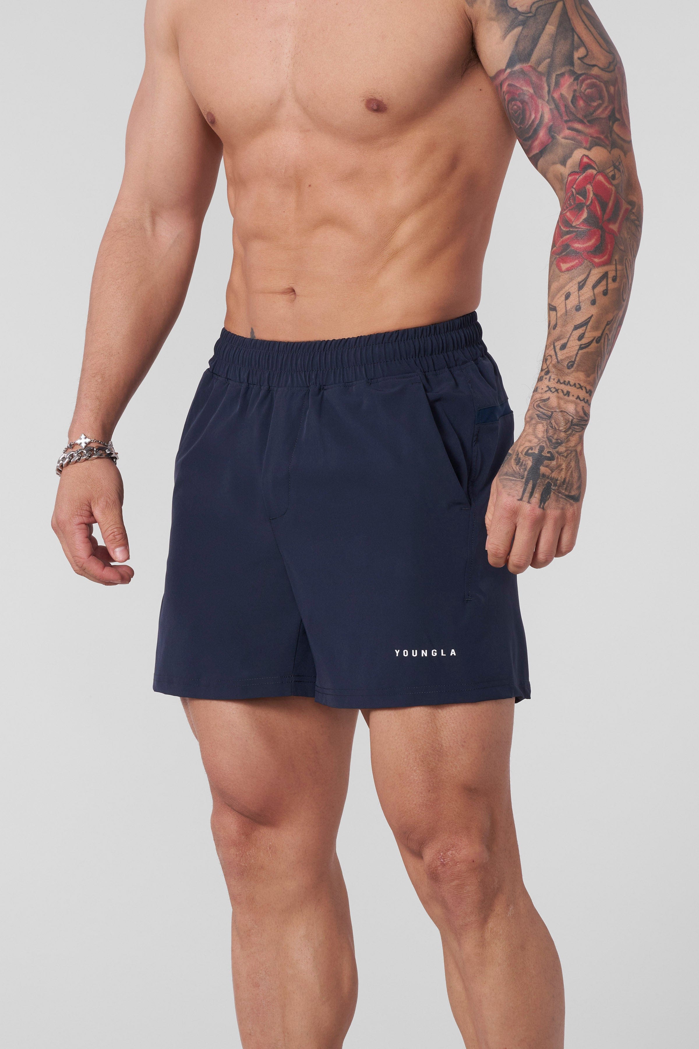 Side angle of model performing lunges wearing lightweight workout shorts