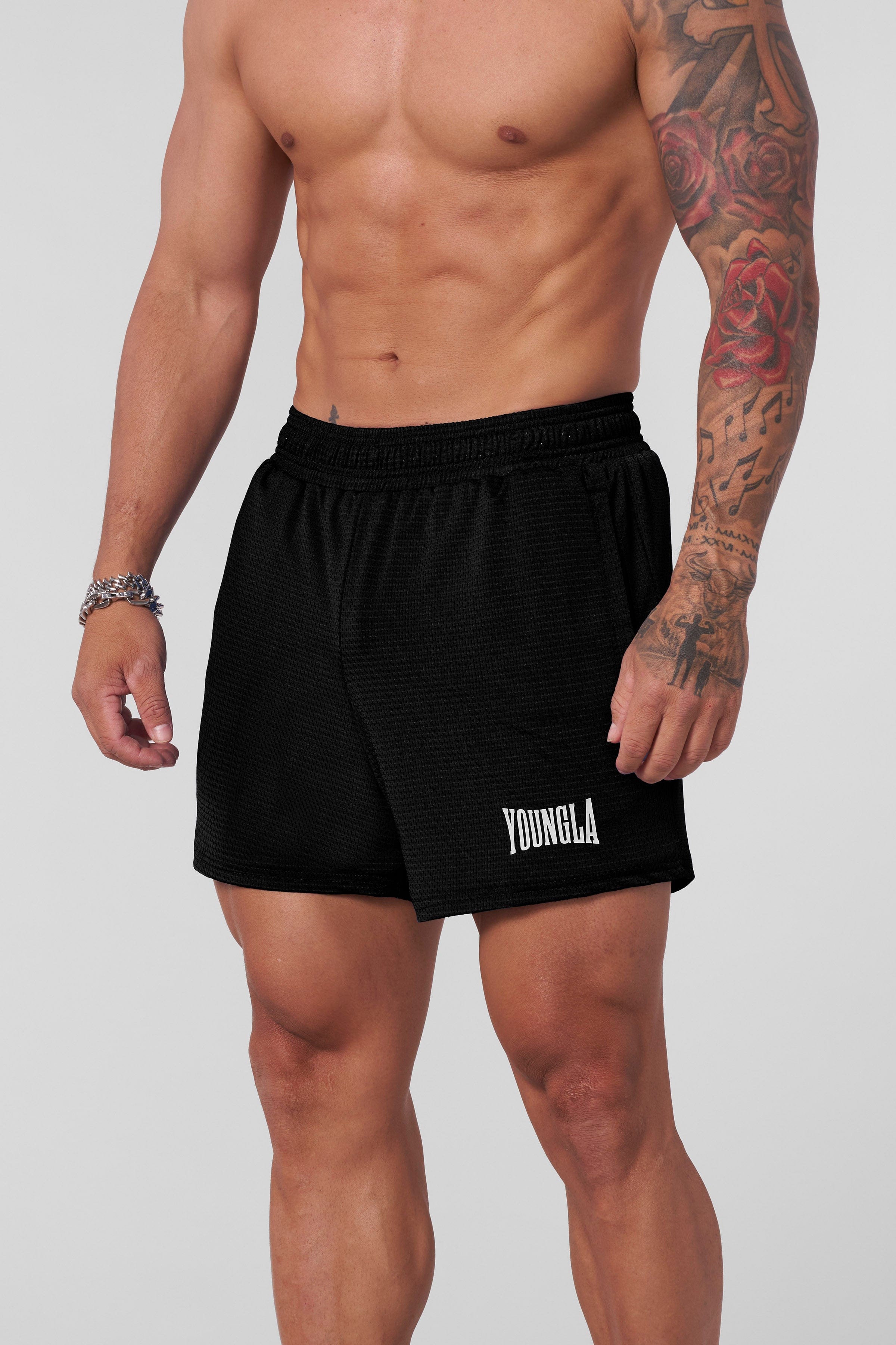Front view of AeroMesh Shorts on a woman during workout, showcasing breathable fabric and fit