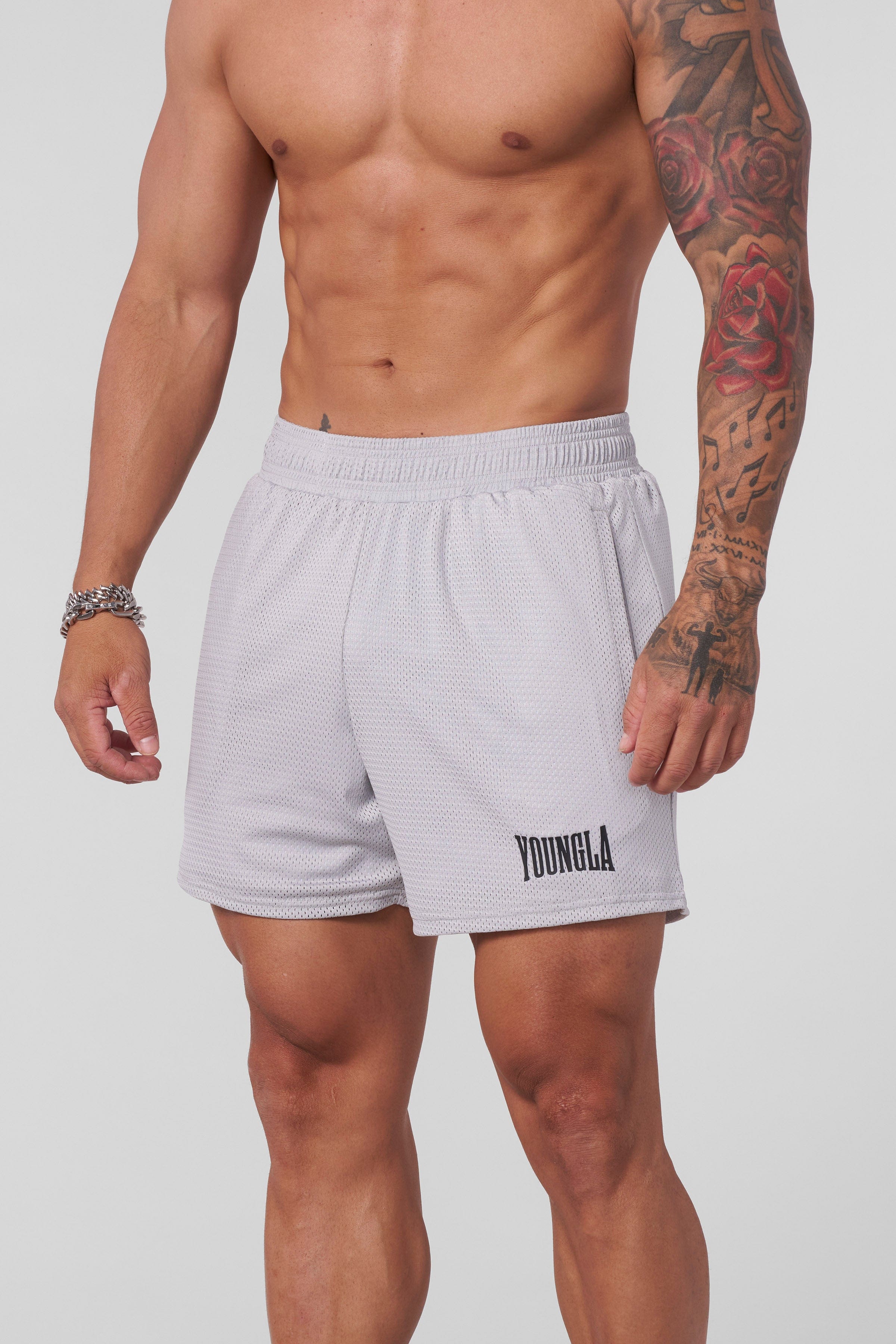 Front view of AeroMesh Shorts on a woman during workout, showcasing breathable fabric and fit