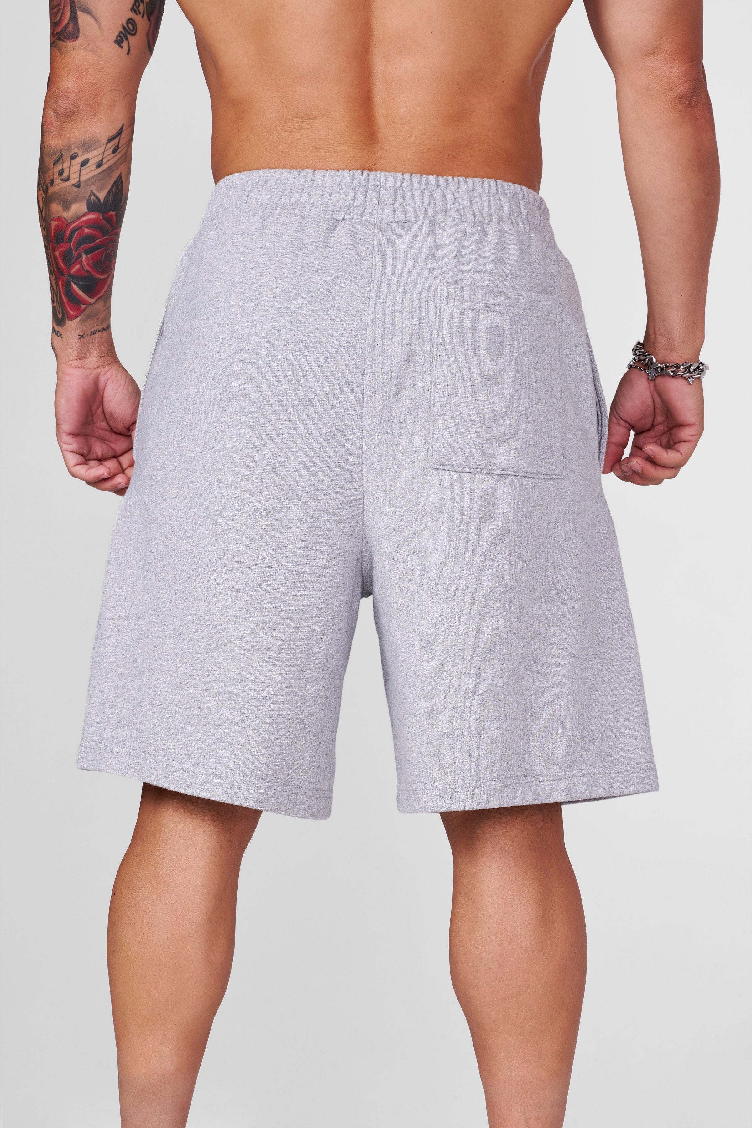 Close-up of the cotton material and long, baggy style of Heritage shorts