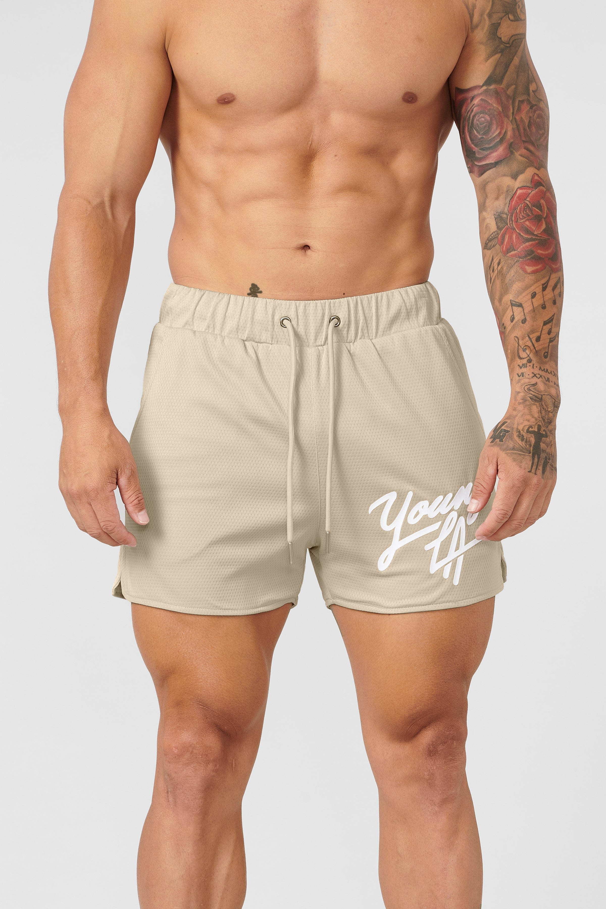 Athlete performing squats in Legacy shorts outdoors