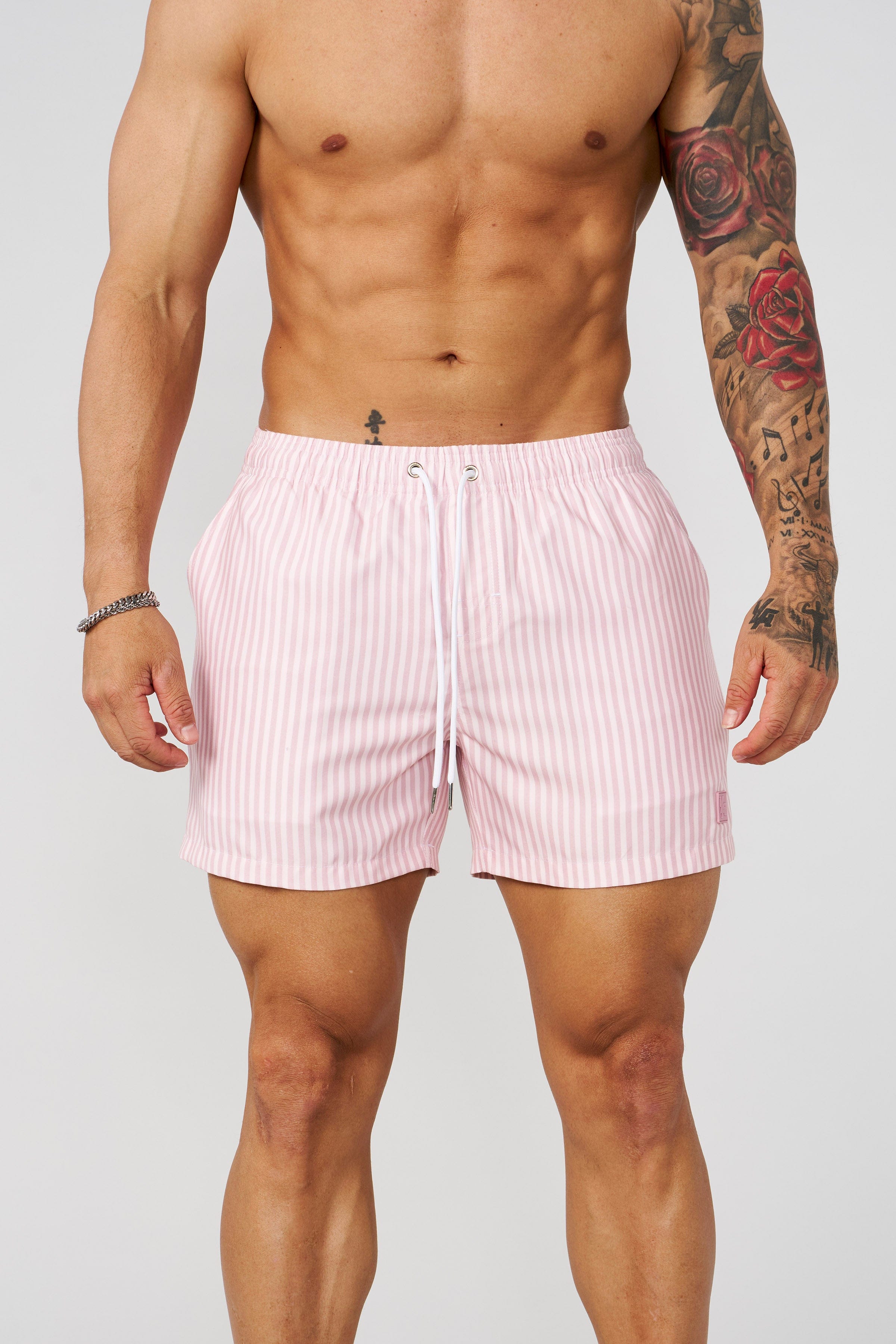Close-up of the fabric and striped design of mens swim trunks short