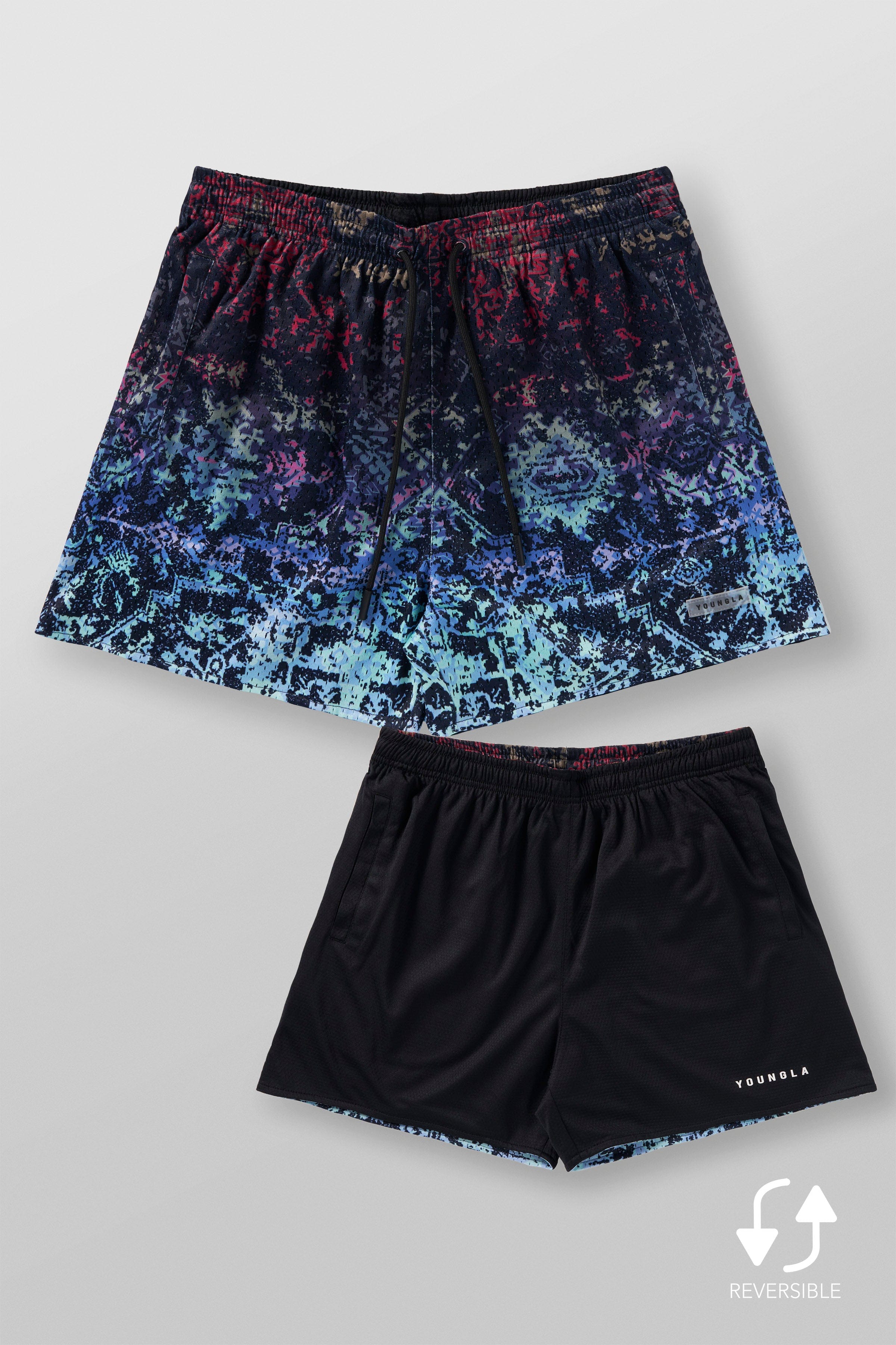 Front view of Persian rug mesh shorts in a natural setting.