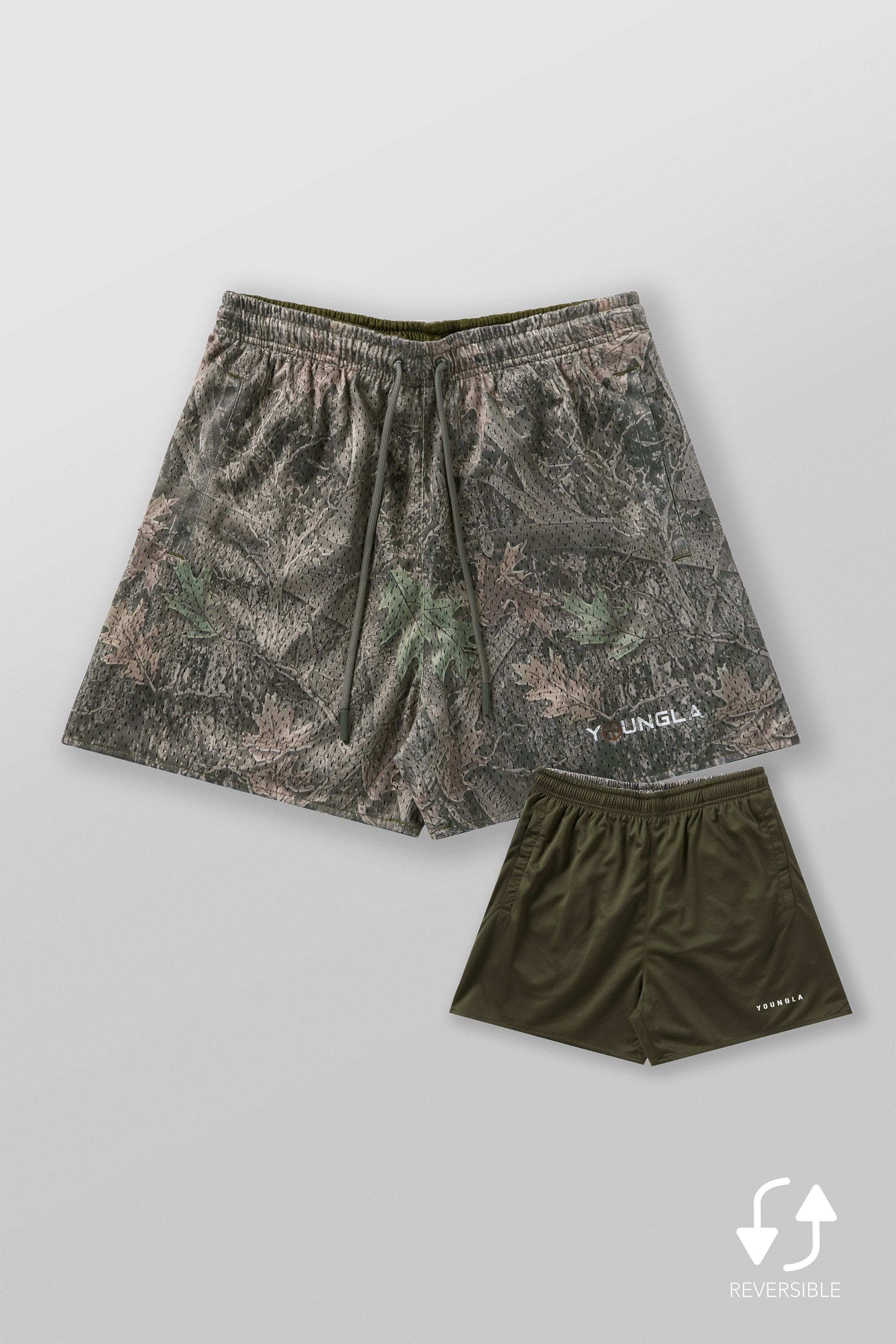 Close-up of mens camo shorts showcasing mesh texture and tree camouflage design