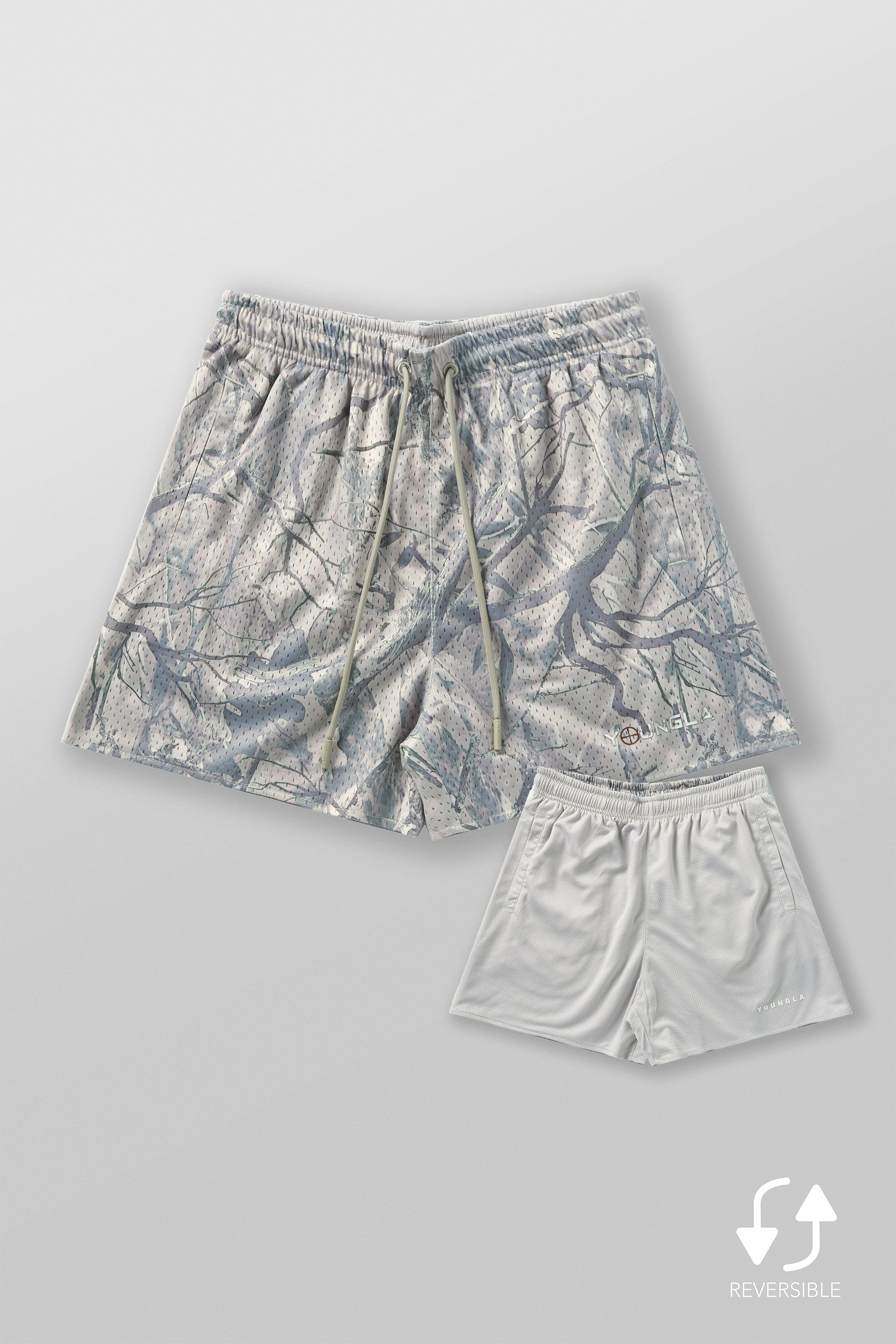 Athletic build wearing these camo cargo shorts during a workout session