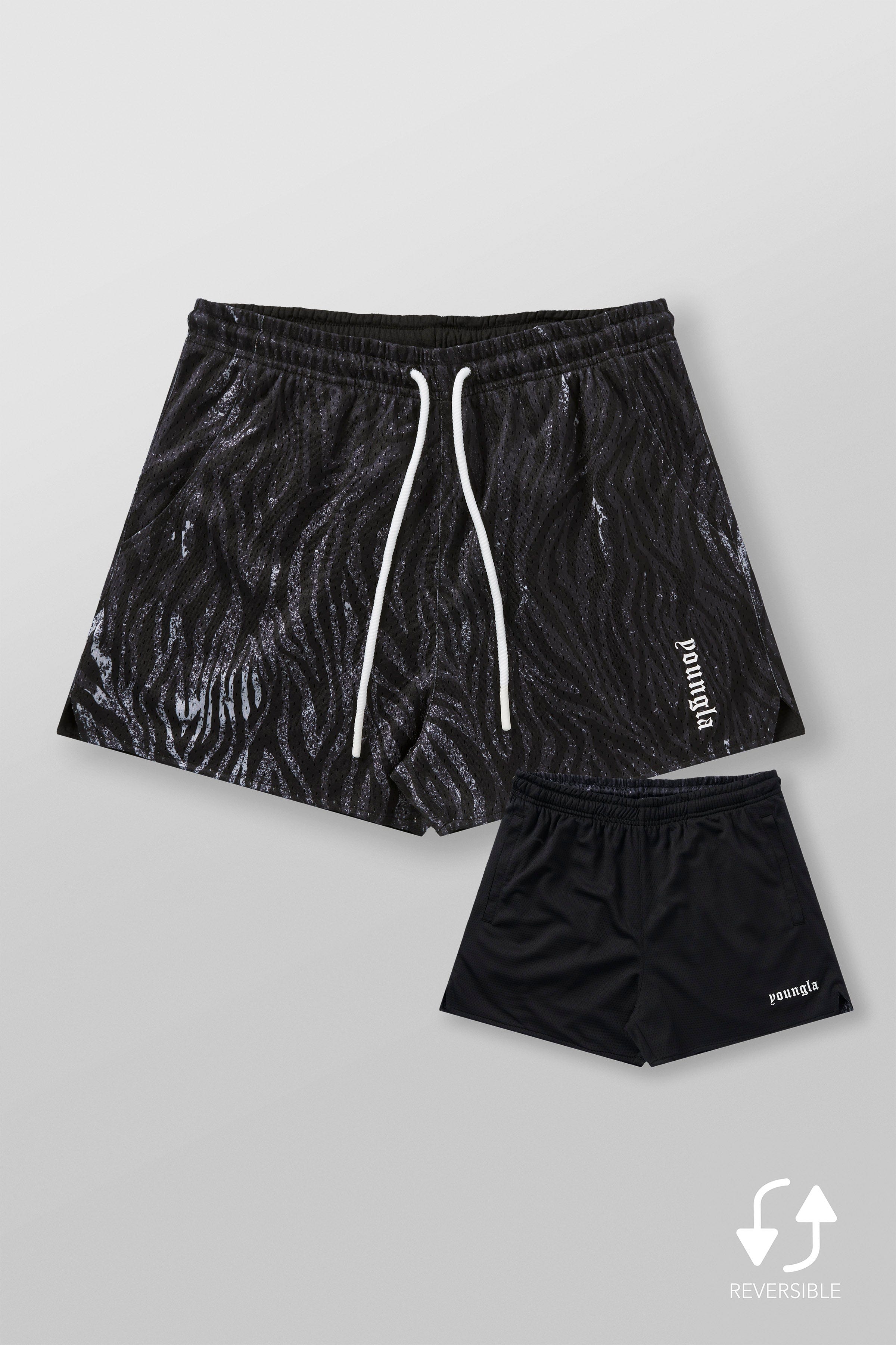 Back view of mens mesh shorts, highlighting the solid color when flipped inside out.