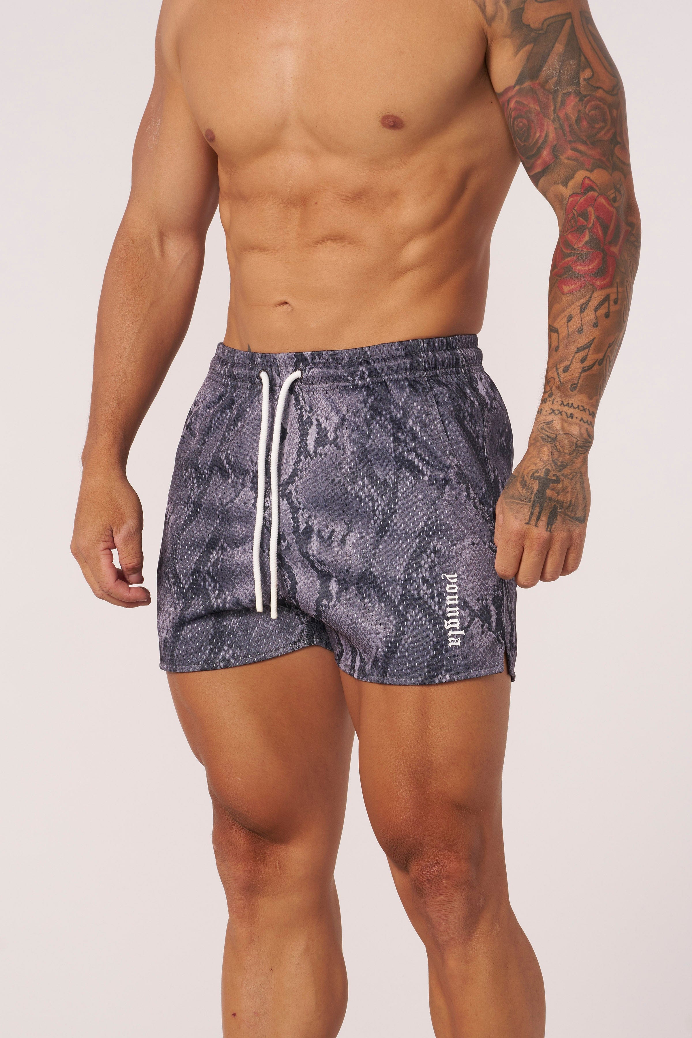 Front view of reversible animal print mesh shorts for men, showcasing the vibrant design.
