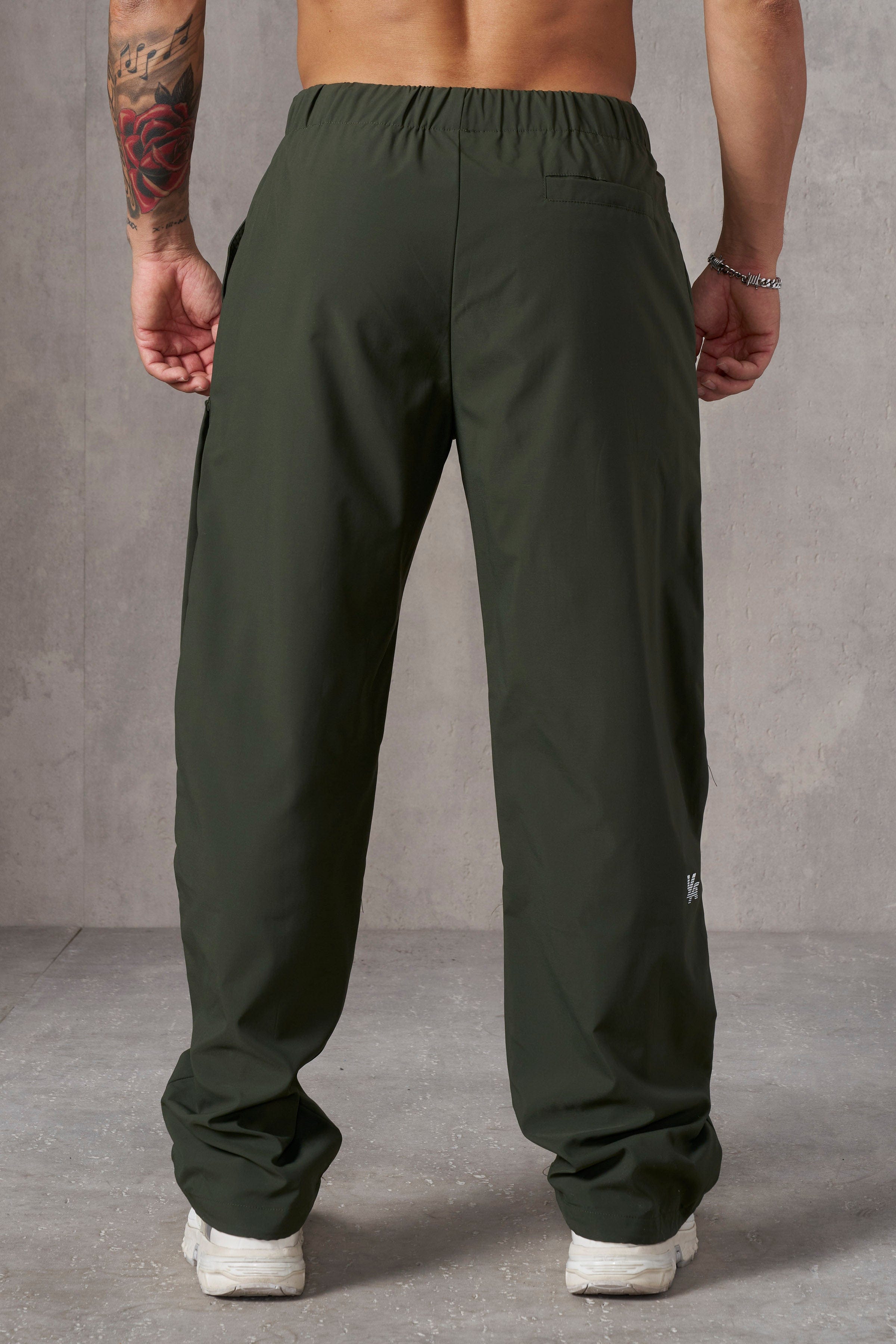 Man in waterproof work pants during heavy rain