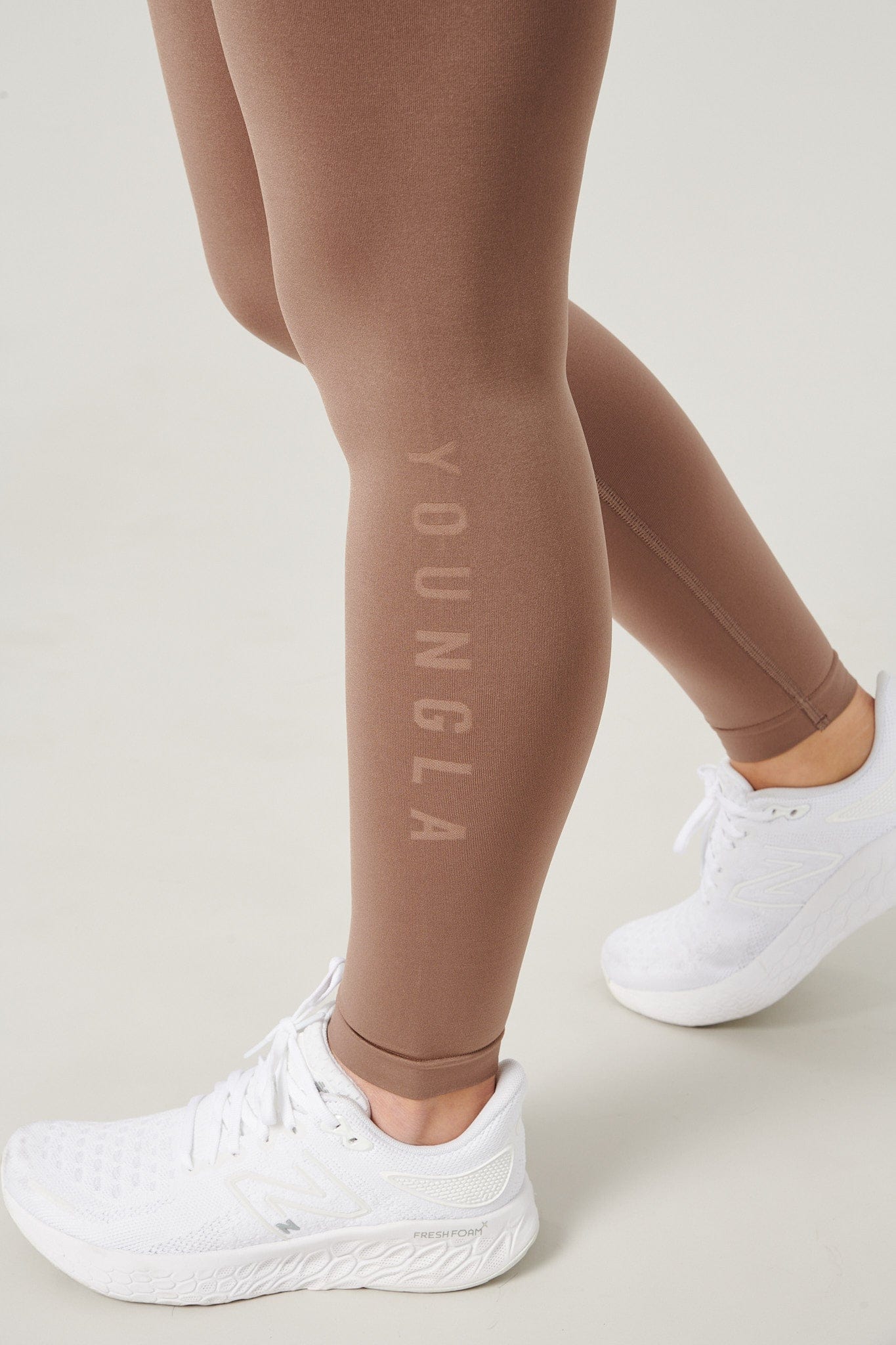 Back view showcasing the curve-enhancing design of the leggings.