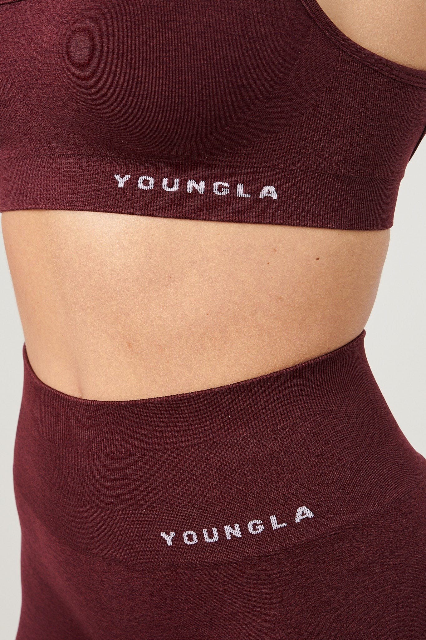 Seamless scoop neck sports bra laid flat on a table.