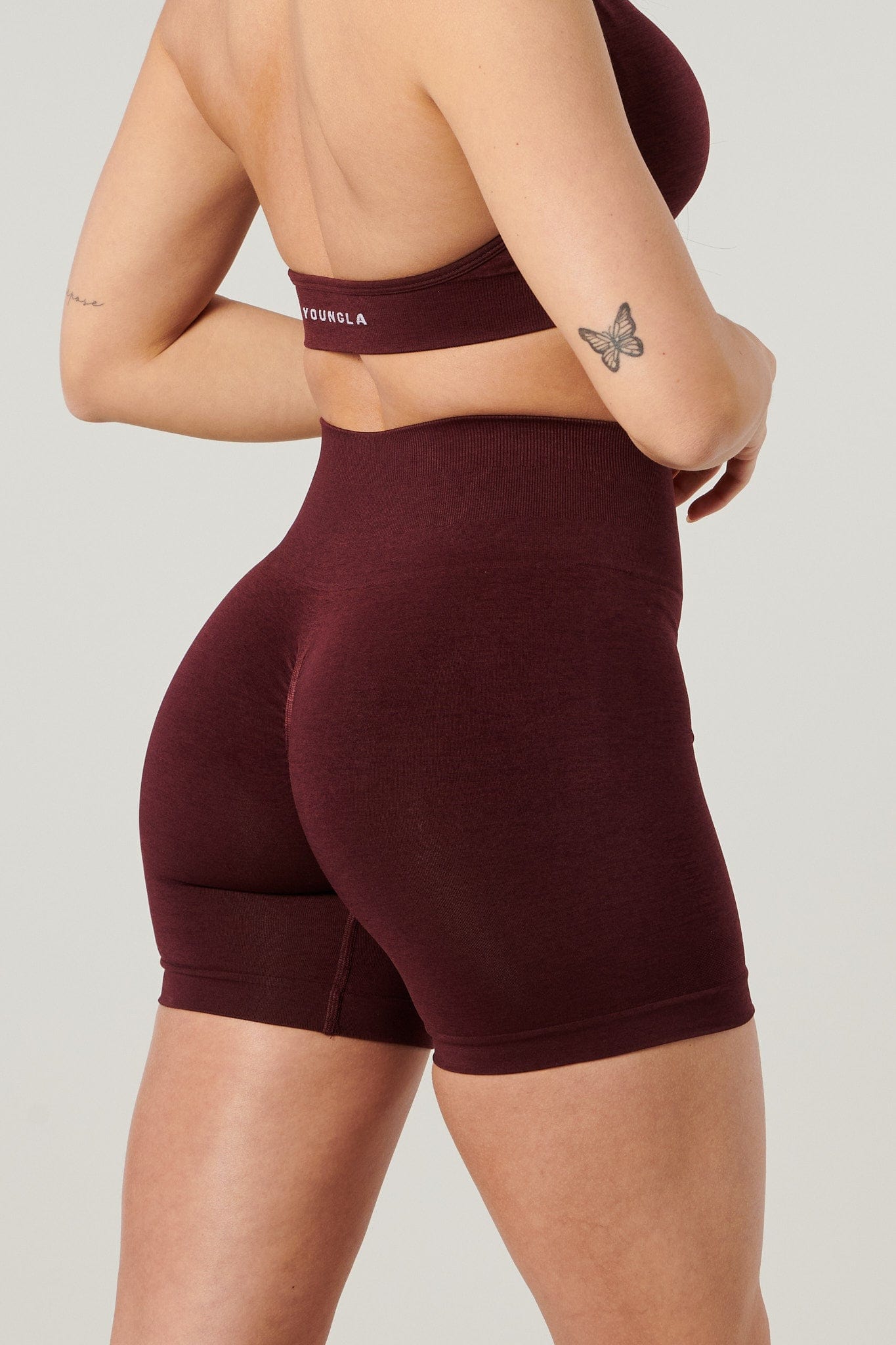 Close-up of the gentle waistband and back scrunch seam of the shorts.