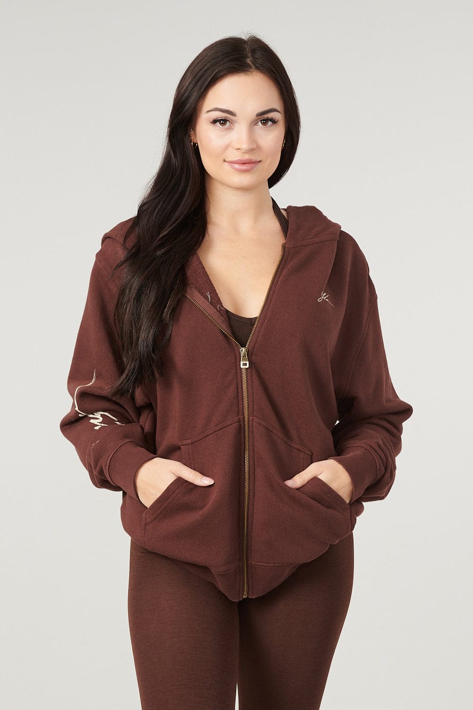 Detail of the YoungLA logo on the sleeve of the zip up hoodie.
