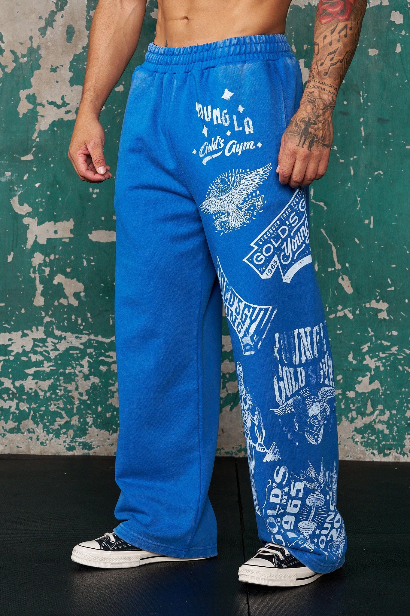 Close-up of the acid-washed fabric of Golds Gym sweatpants, highlighting the vintage style.
