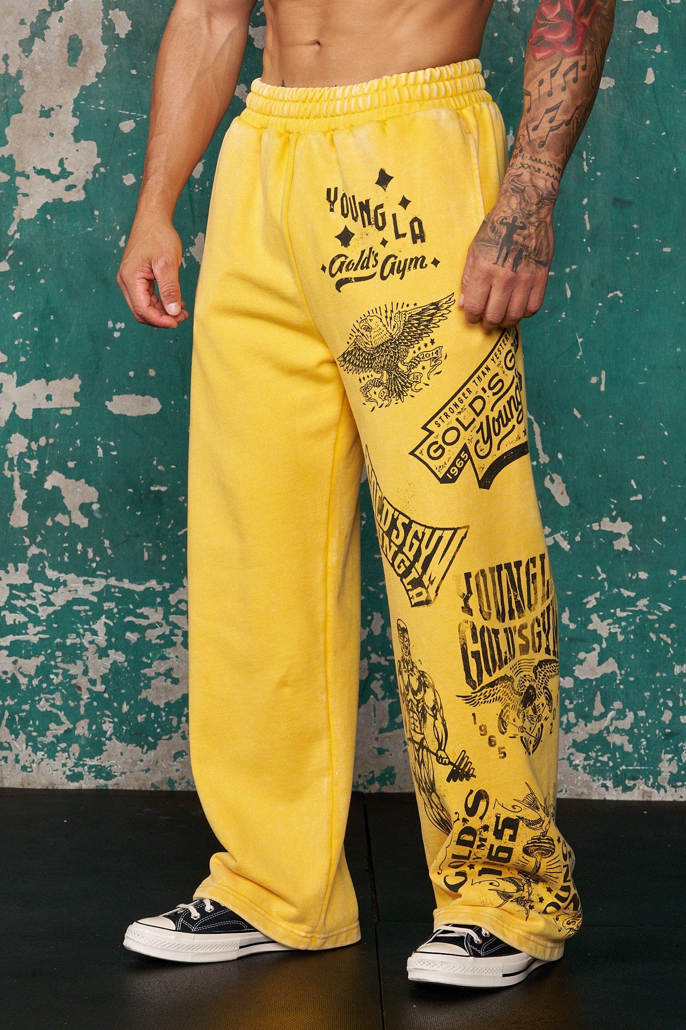Close-up of the acid-washed fabric of Golds Gym sweatpants, highlighting the vintage style.
