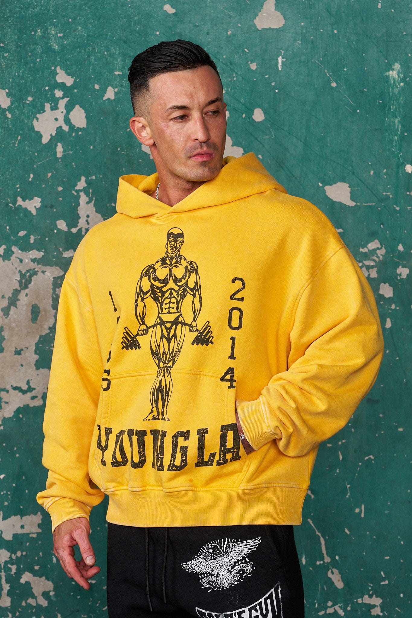 Front view of oversized hoodie showing distressed Gold's Gym graphic